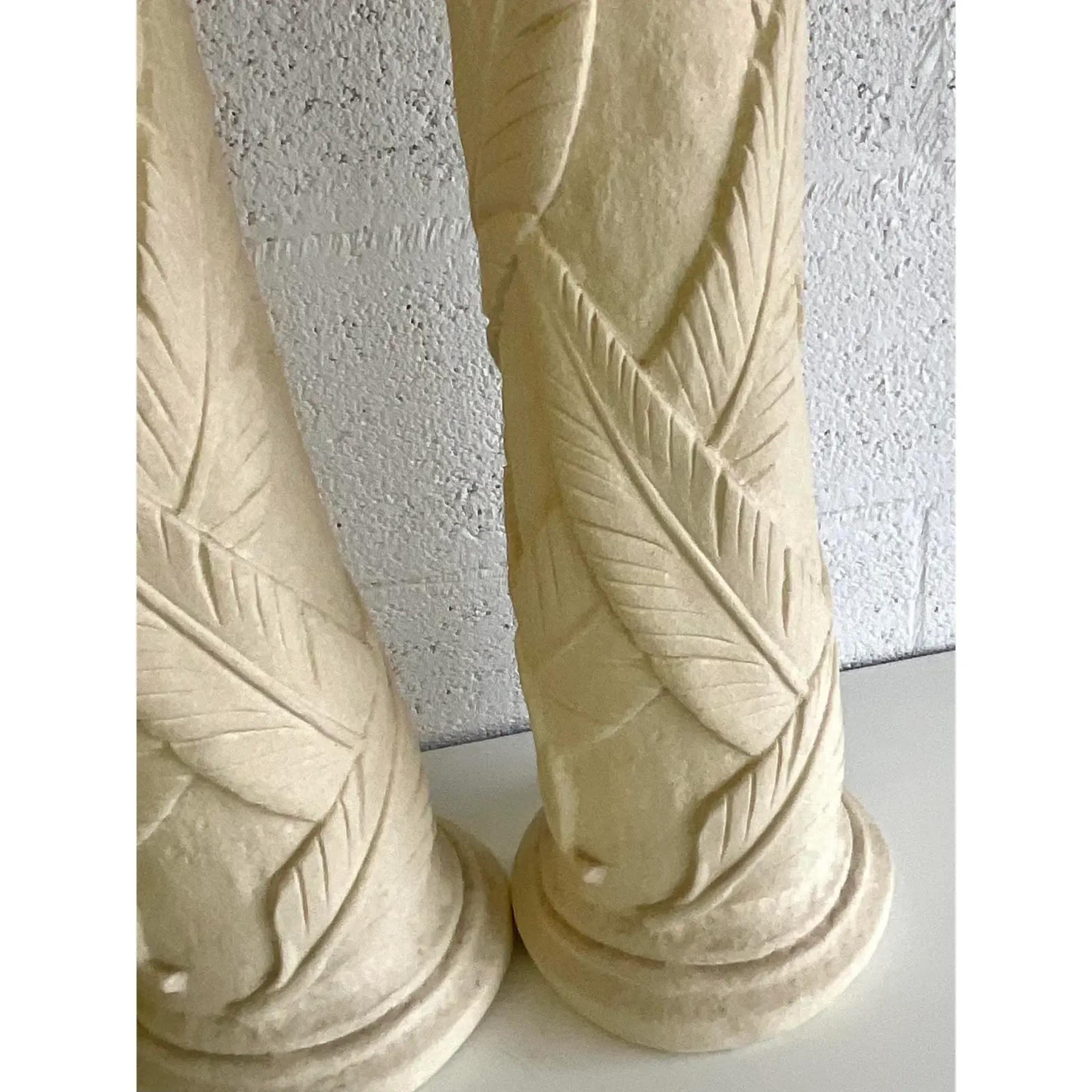 Fantastic pair of vintage plaster lamps. Beautiful fern relief on tall and elegant cylinder bases. Perfect as is or paint them a bright white for a clean modern look. Acquired from a Palm Beach estate. 