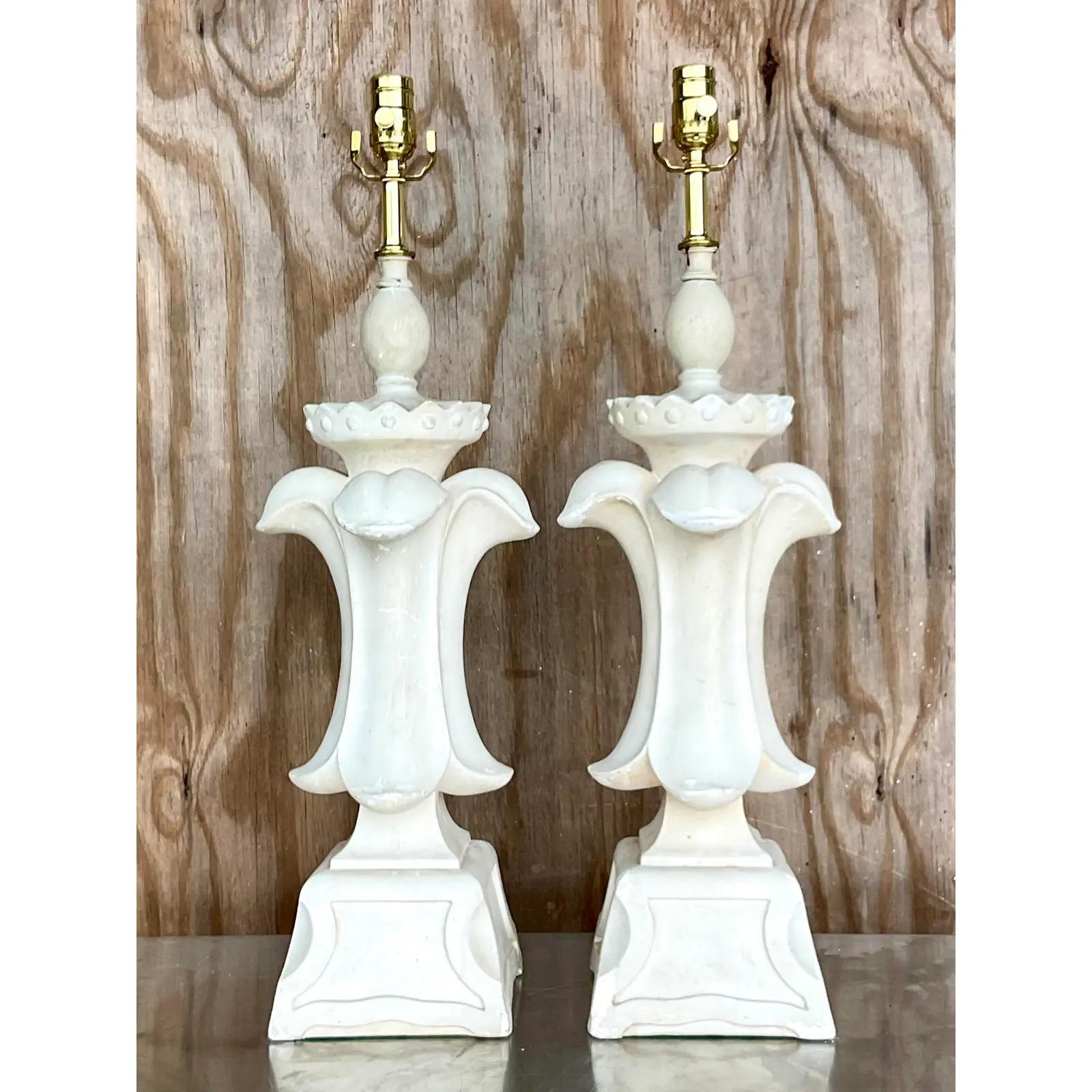 Gorgeous pair of vintage plaster table lamps. A classic fleur de lis design. All new wiring and hardware. The finish has all the patina of time with little areas of distress. I think it looks perfect with a little age on it. If you want a more