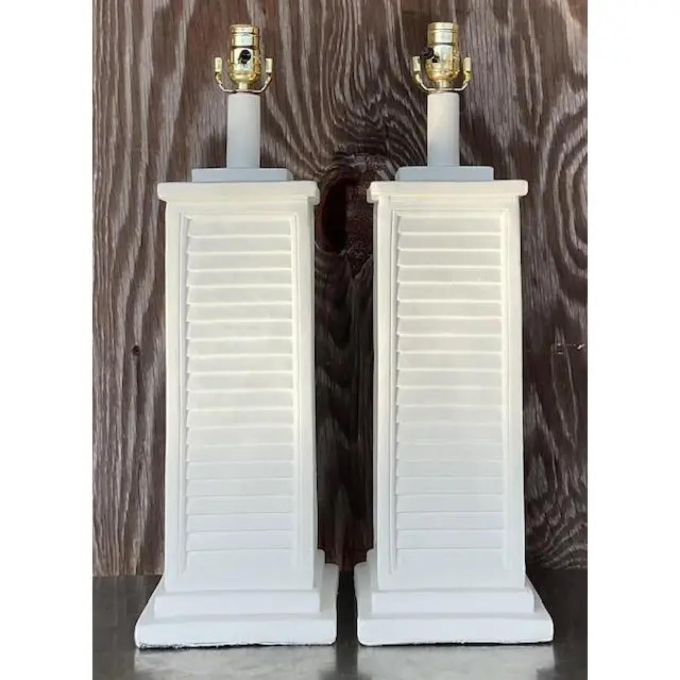 A fabulous pair of vintage Coastal table lamps. A chic white plaster finish on a chic louvered design. Acquired from a Palm Beach estate. less