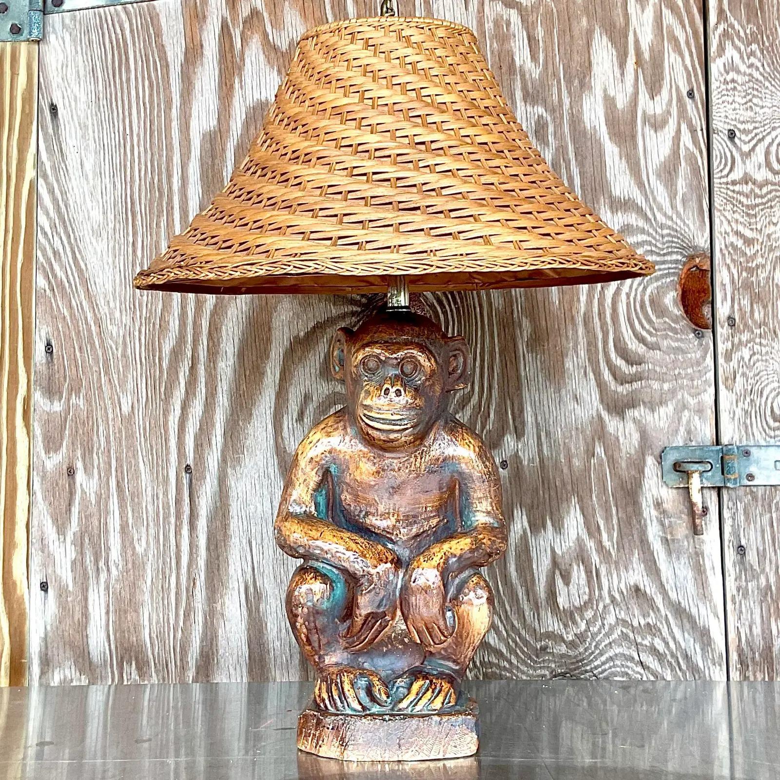 A fantastic vintage Coastal table lamp. A charming plaster monkey with a coordinating vintage shade. Even a handsome little monkey finial. Acquired from a Palm Beach estate.
