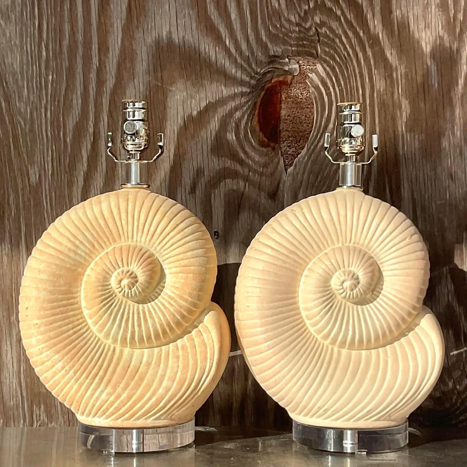 A fabulous pair of vintage Coastal table lamps. Beautiful nautilus shell design crafted in plaster. Gorgeous patina from time. Fully restored with all new wiring and hardware. Acquired from a Palm Beach estate.

The lamps are in great vintage