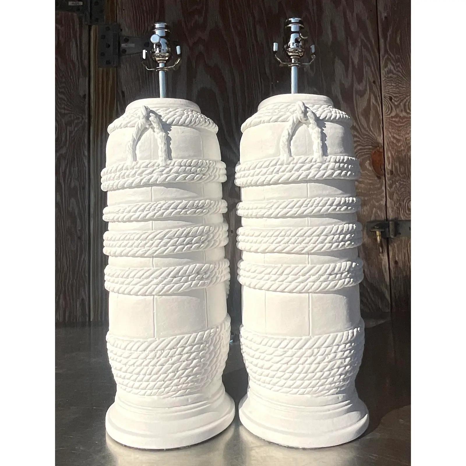 A fabulous vintage coastal pair of lamps. A chic plaster finish with a cool rope design. Fully restored with all new writing and hardware. Acquired from a Palm Beach estate.

The lamps are in great vintage condition. Minor scuffs and blemishes