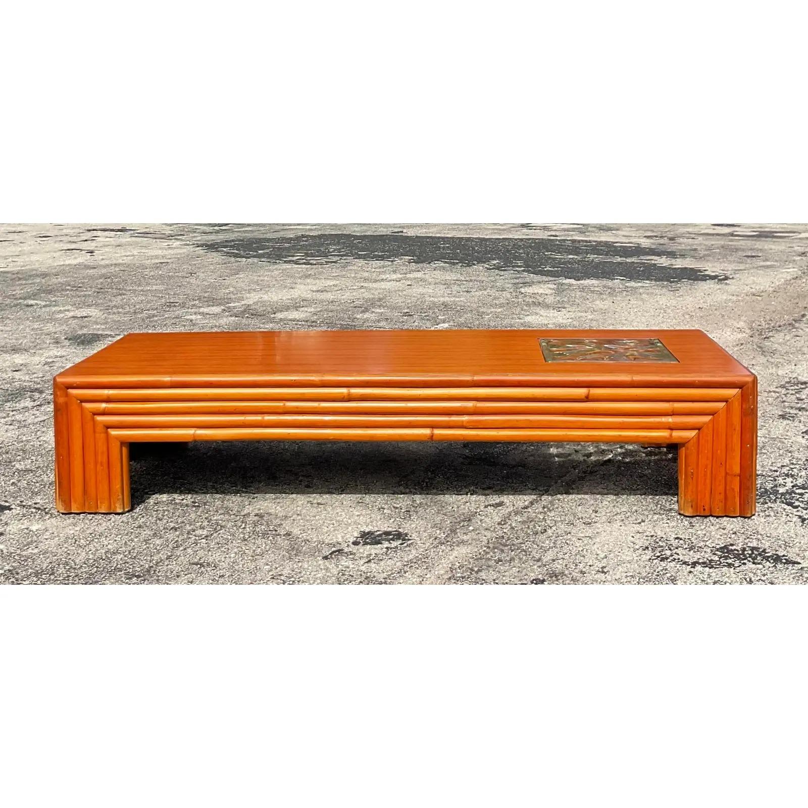A fabulous vintage Coastal coffee table. A chic and simple design with thick pretzel rattan frame and a laminate top and inset glass cube. Gorgeous and functional. Perfect for high traffic areas or your Airbnb. Acquired from a Palm Beach estate.