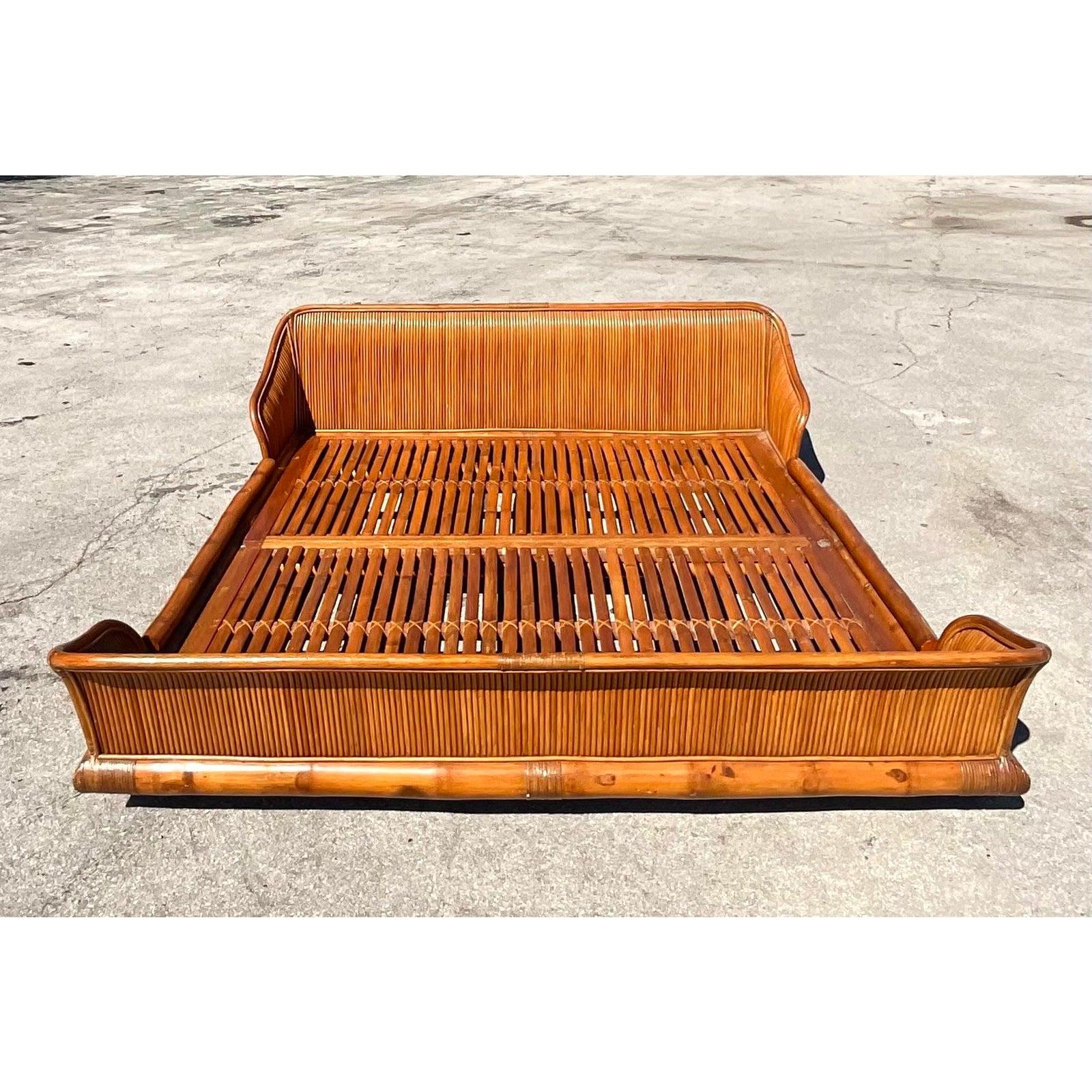 Incredible vintage Pretzel Reed king bed. Beautiful sleigh shape with beautiful sloping headboard and foot board. Natural slat rails. Acquired from a Palm Beach estate.