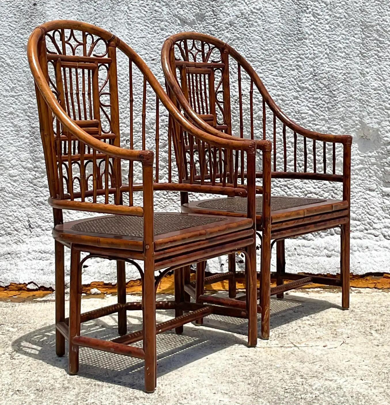 Bring coastal elegance to your home with this pair of Vintage Coastal Rattan Brighton Pavillon Chairs. Featuring intricate rattan craftsmanship and a breezy, relaxed vibe, these chairs are perfect for adding seaside charm to any room. 