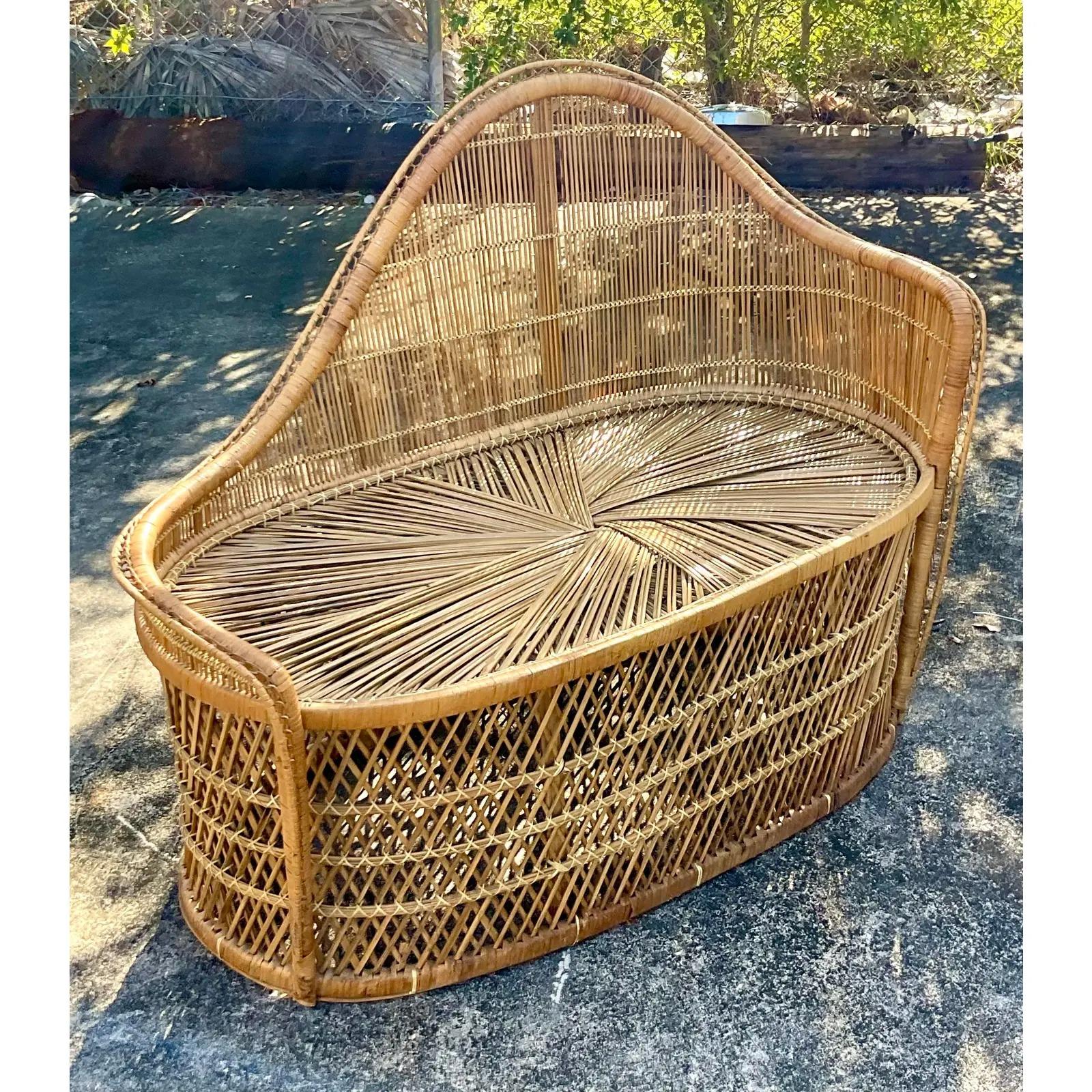 Fantastic vintage Coastal chaise lounge. A beautiful twisted rattan in a chic rolling back. Acquired from a Palm Beach estate.