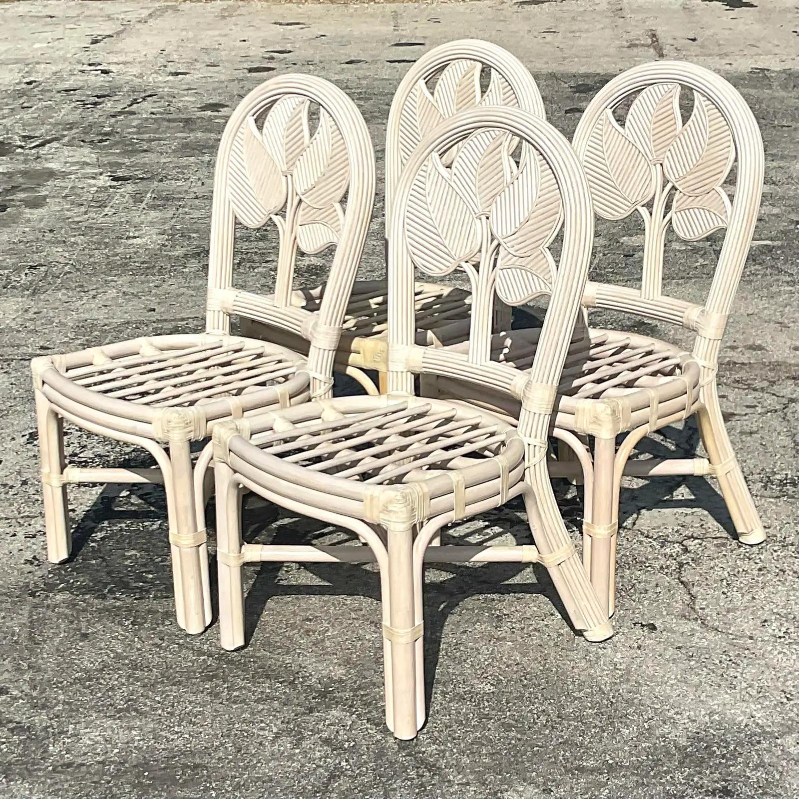 A set of four gorgeous vintage coastal rattan dining chairs. Acquired at a Palm Beach estate.