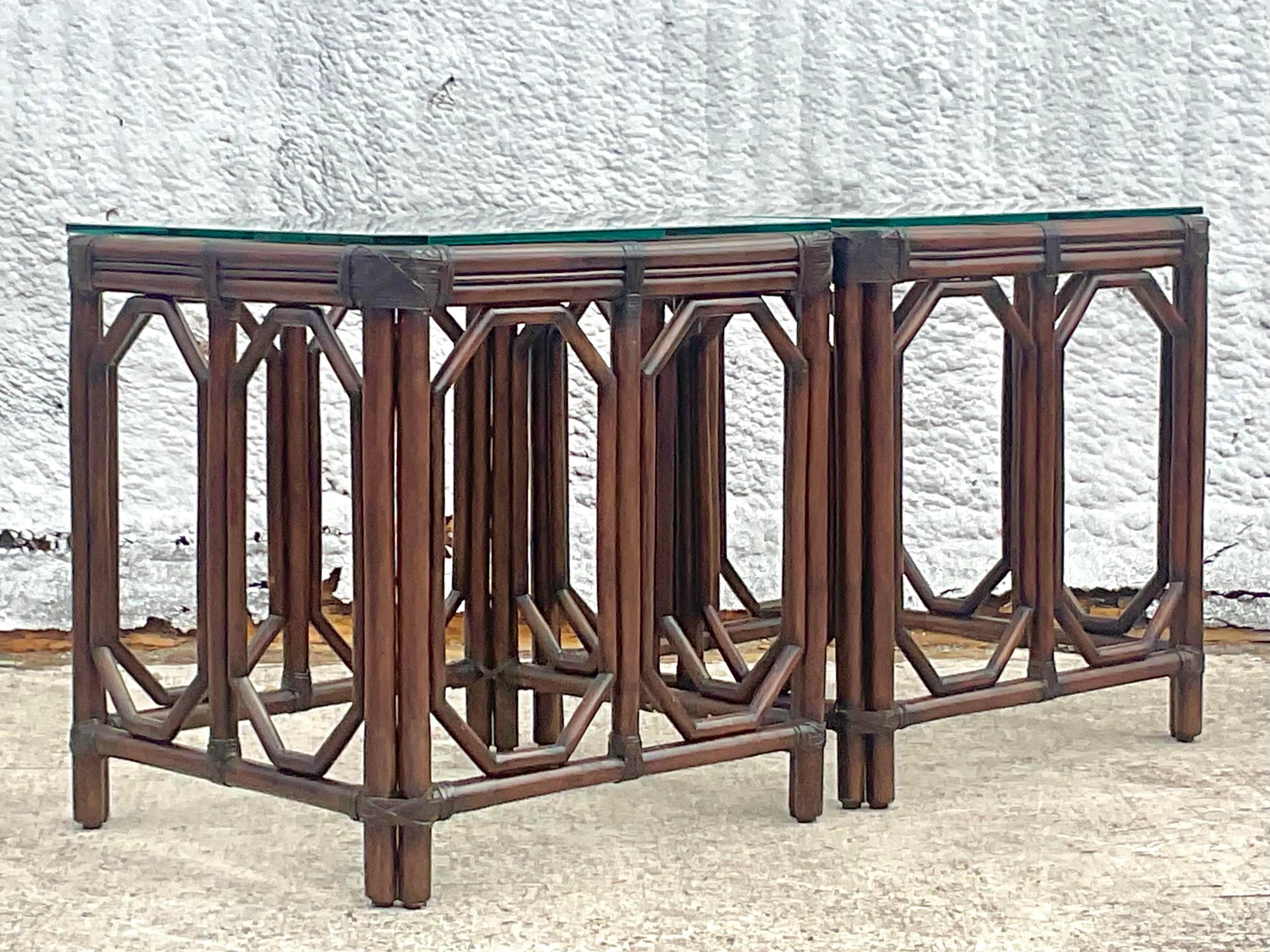A fabulous pair of vintage Coastal side table. Beautiful octagon fretwork in the rattan. A deep rich brown finish. Acquired from a Palm Beach estate.