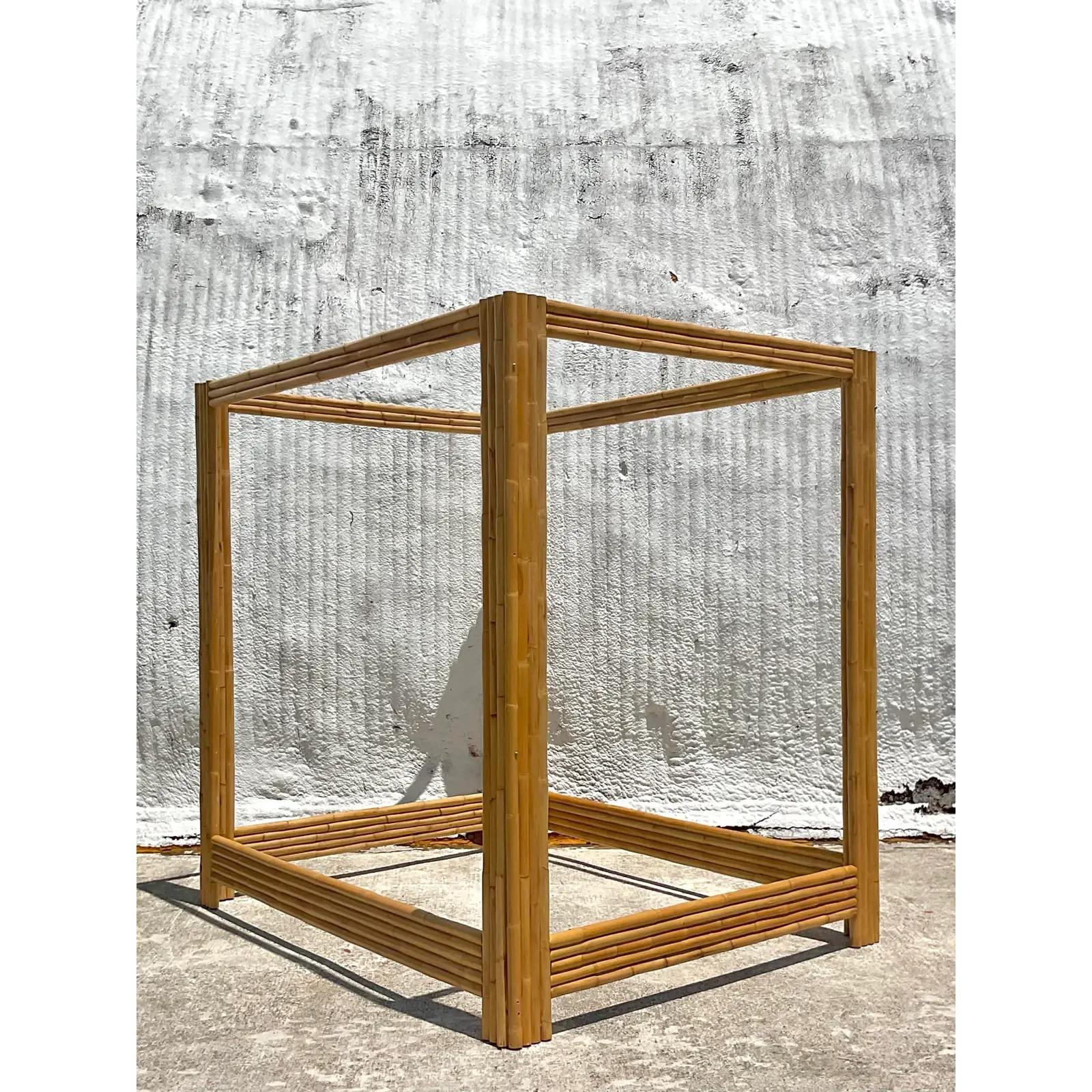 A fabulous vintage Coastal Full canopy bed. A chic rattan frame in a clean and simple design. Perfect to add a little drama and excitement to any space. Acquired from a Palm Beach estate.

The bed is in great vintage condition. Minor scuffs and