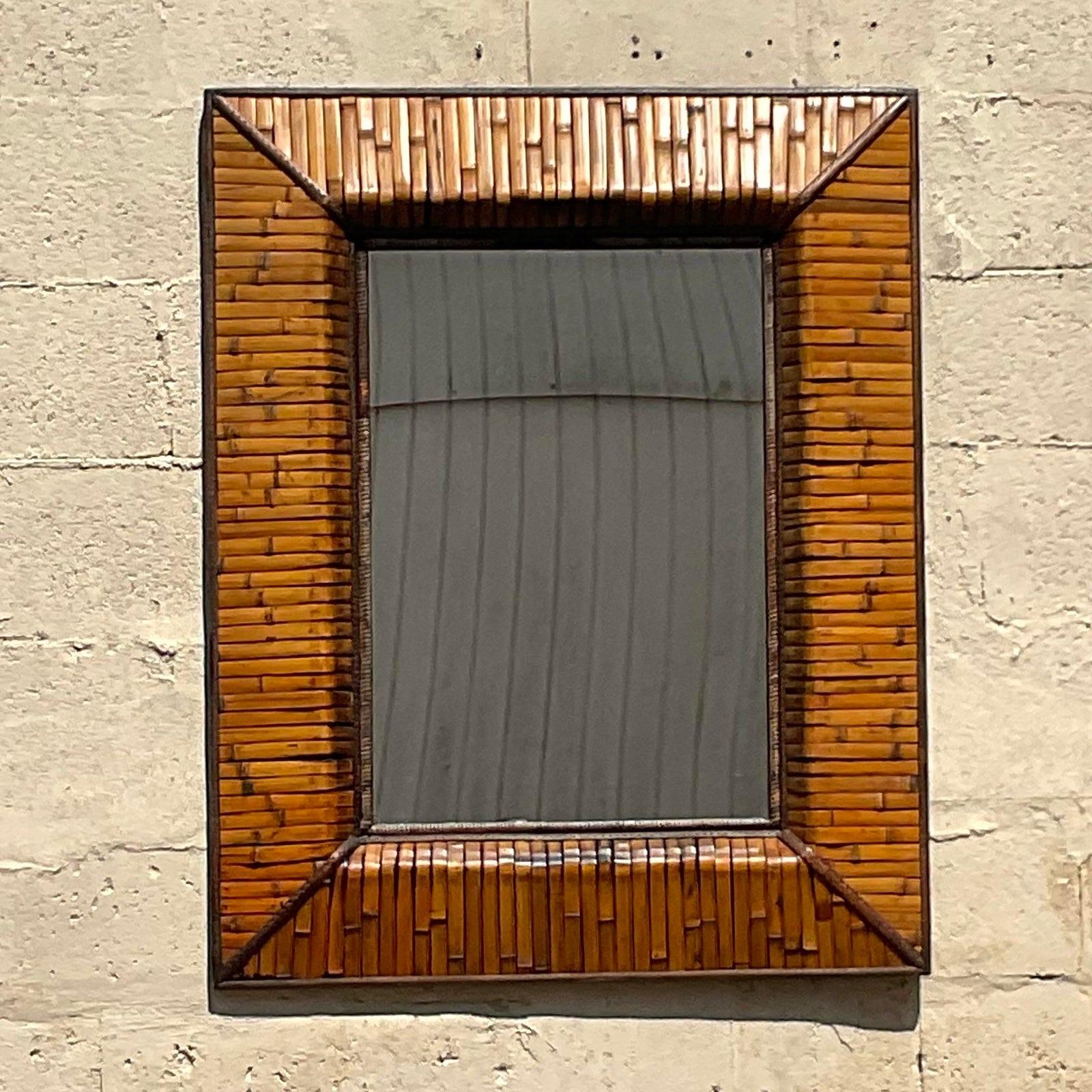 A fabulous vintage Coastal wall mirror. A chic wrapped rattan in a rich warm color. Acquired from a Palm Beach estate.