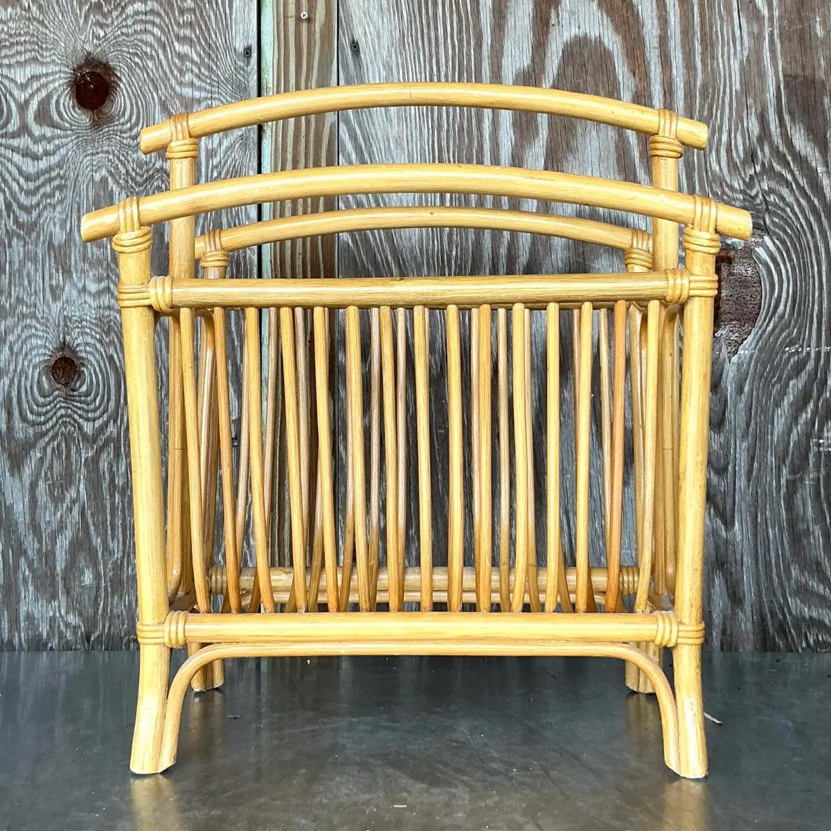 Organize in style with this Vintage Coastal Rattan Newspaper Rack. Handwoven with natural rattan, it exudes beachy vibes and laid-back charm. Perfect for keeping your magazines or papers neatly stored while adding a touch of coastal flair to your