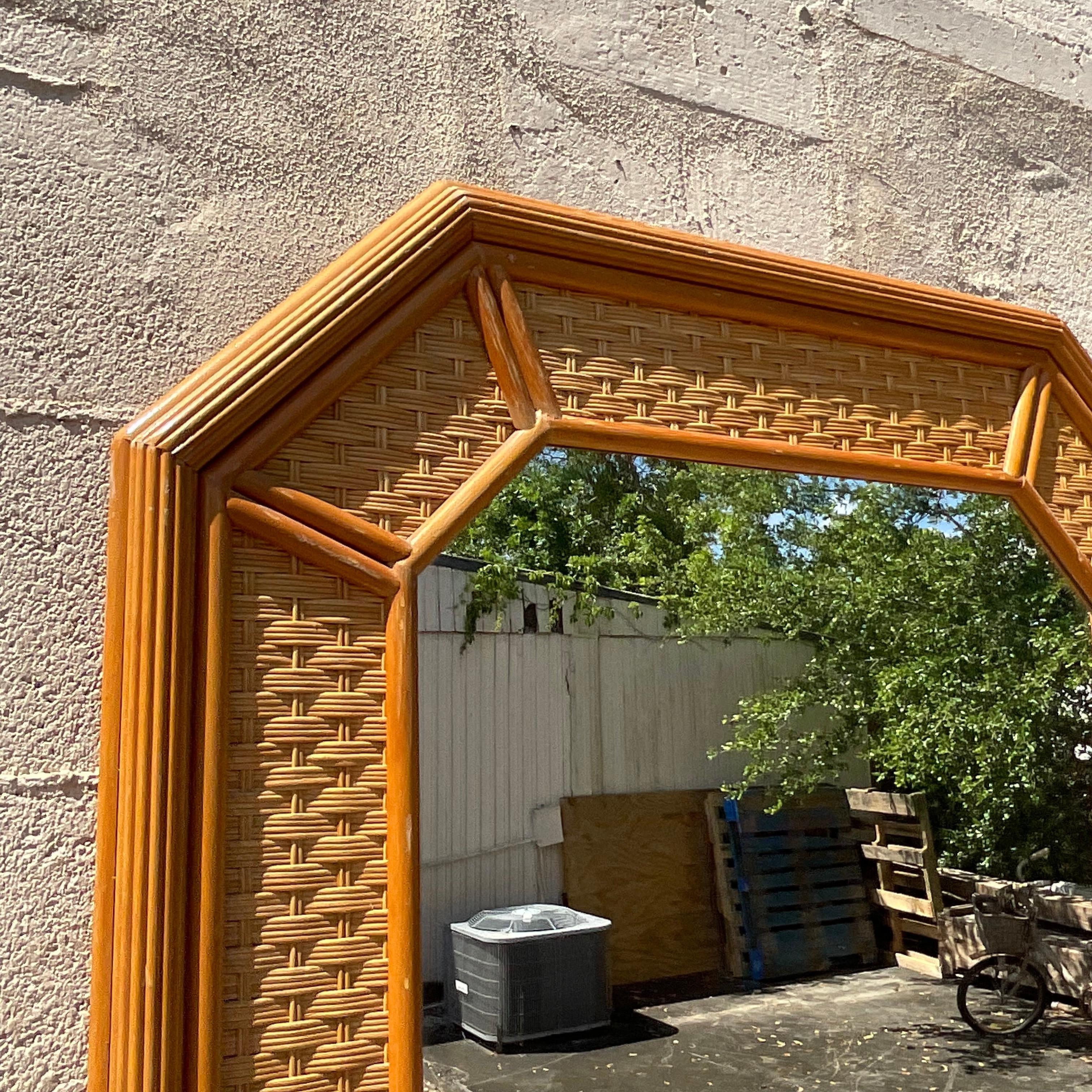 Embrace coastal elegance with our Vintage Coastal Rattan Octagon Mirror. American-crafted with a distinctive octagon shape and natural rattan, this mirror captures seaside charm, blending classic design with relaxed coastal vibes for a refreshing