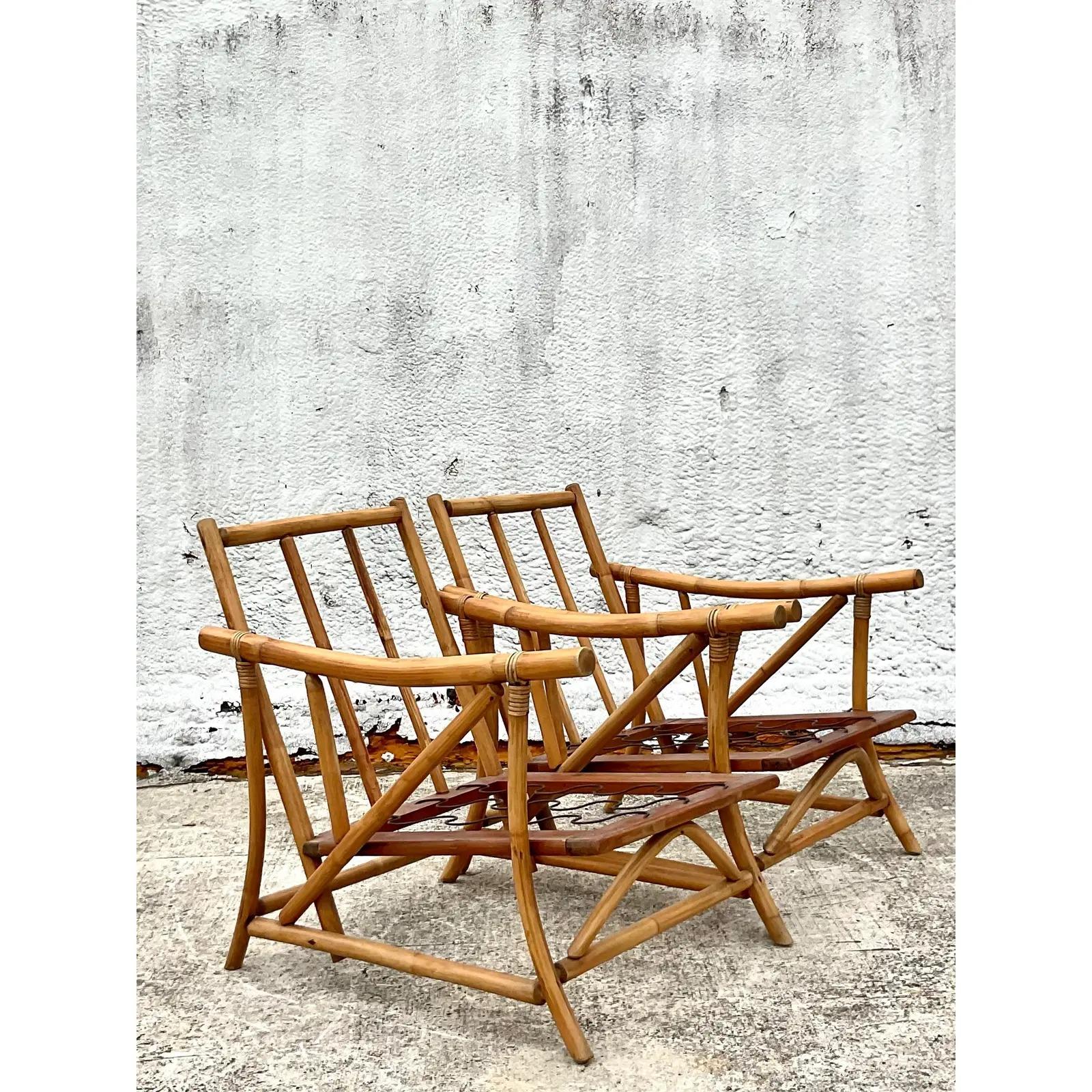 Fantastic pair of vintage Coastal lounge chairs. Beautiful rattan frame with a chic pagoda shape. Acquired from a Palm Beach estate.
