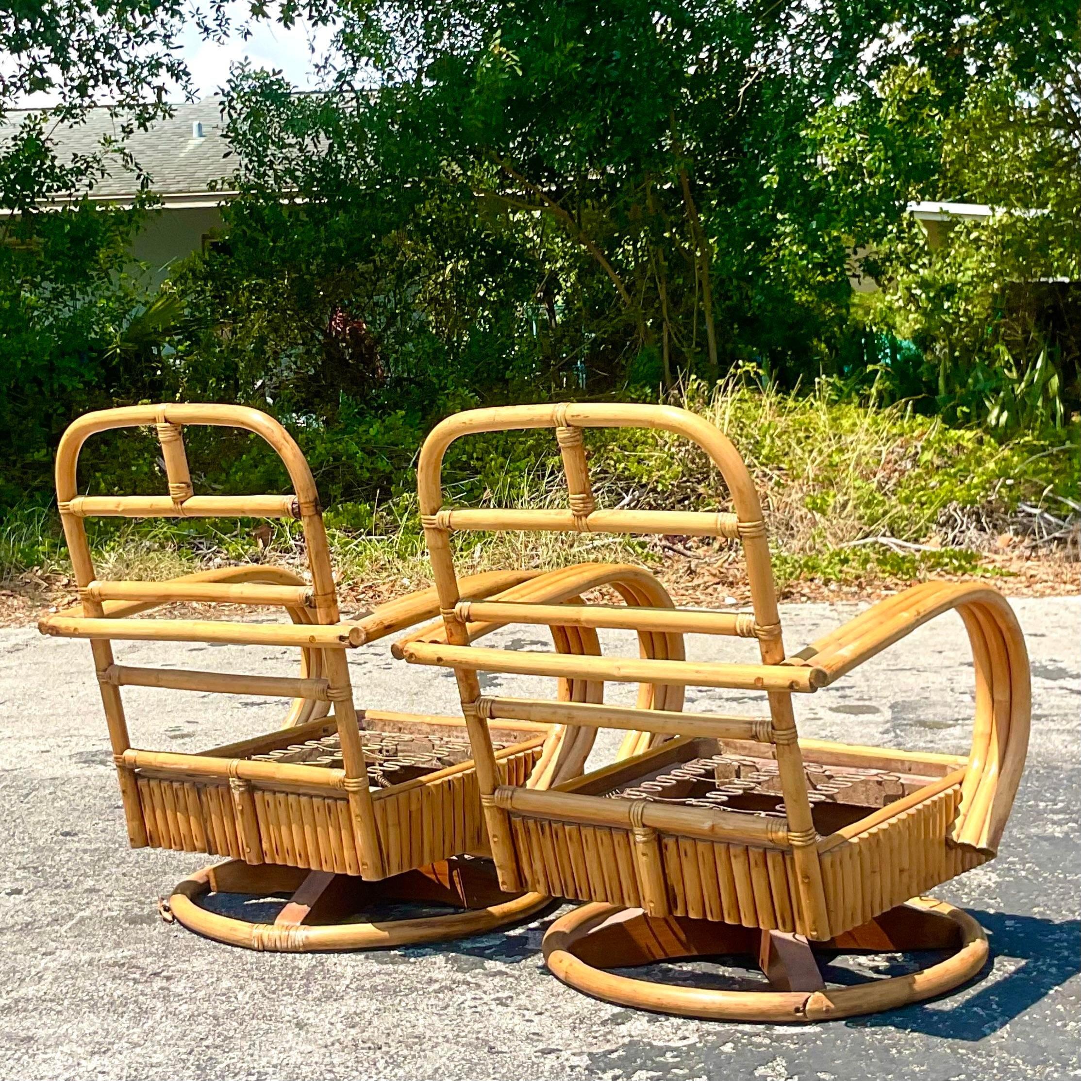 20th Century Vintage Coastal Rattan Swivel Chairs, a Pair