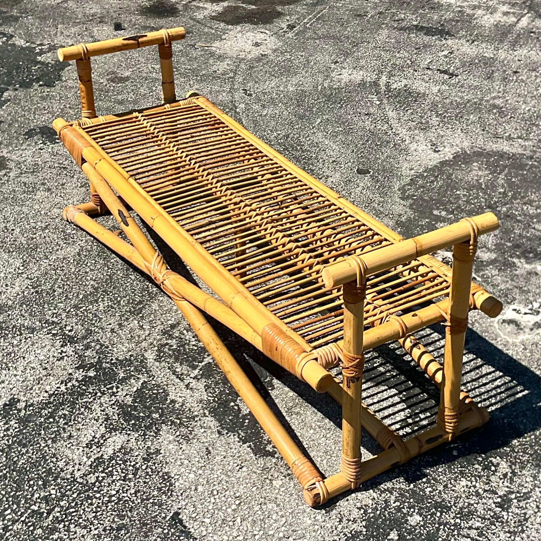 A very chic vintage coastal rattan bench. Perfect for many uses. End of your bed, entry hall or additional outdoor seating. You decide! Acquired at a Palm Beach estate.