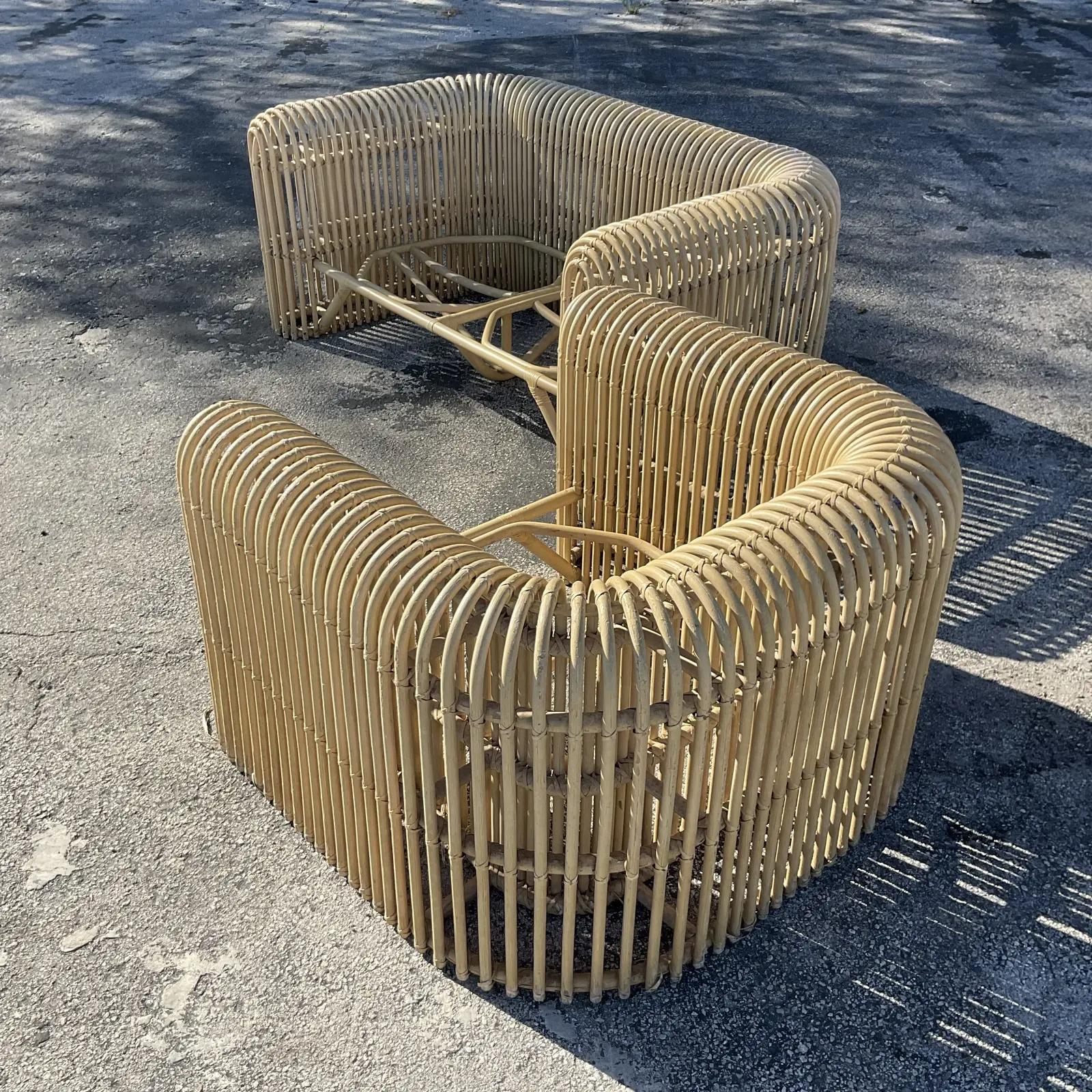An exceptional set of vintage Coastal loveseat and chair. Chic rubber rattan in an iconic waterfall design. Done in the manner of a Henry Olko. Acquired from a Palm Beach estate.

Chair dimensions 40 x 26 x 27

The seats are in great vintage