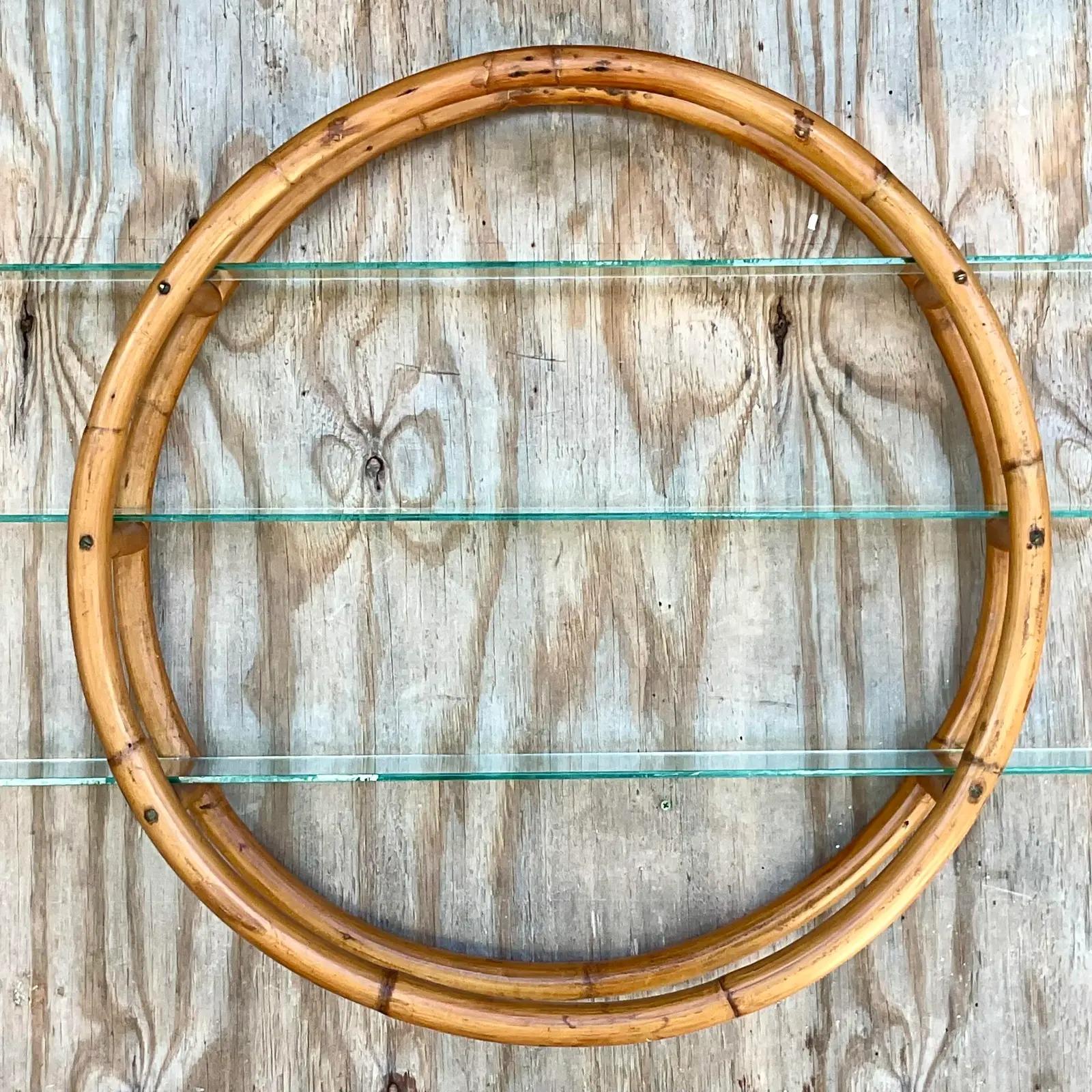 Fantastic vintage wall shelf. Sexy bent rattan in a round shape with inset glass shelves. You can cut down the shelves if you need it to fit into a smaller space. If you have a larger space there are two shelves available as well. So amazing.