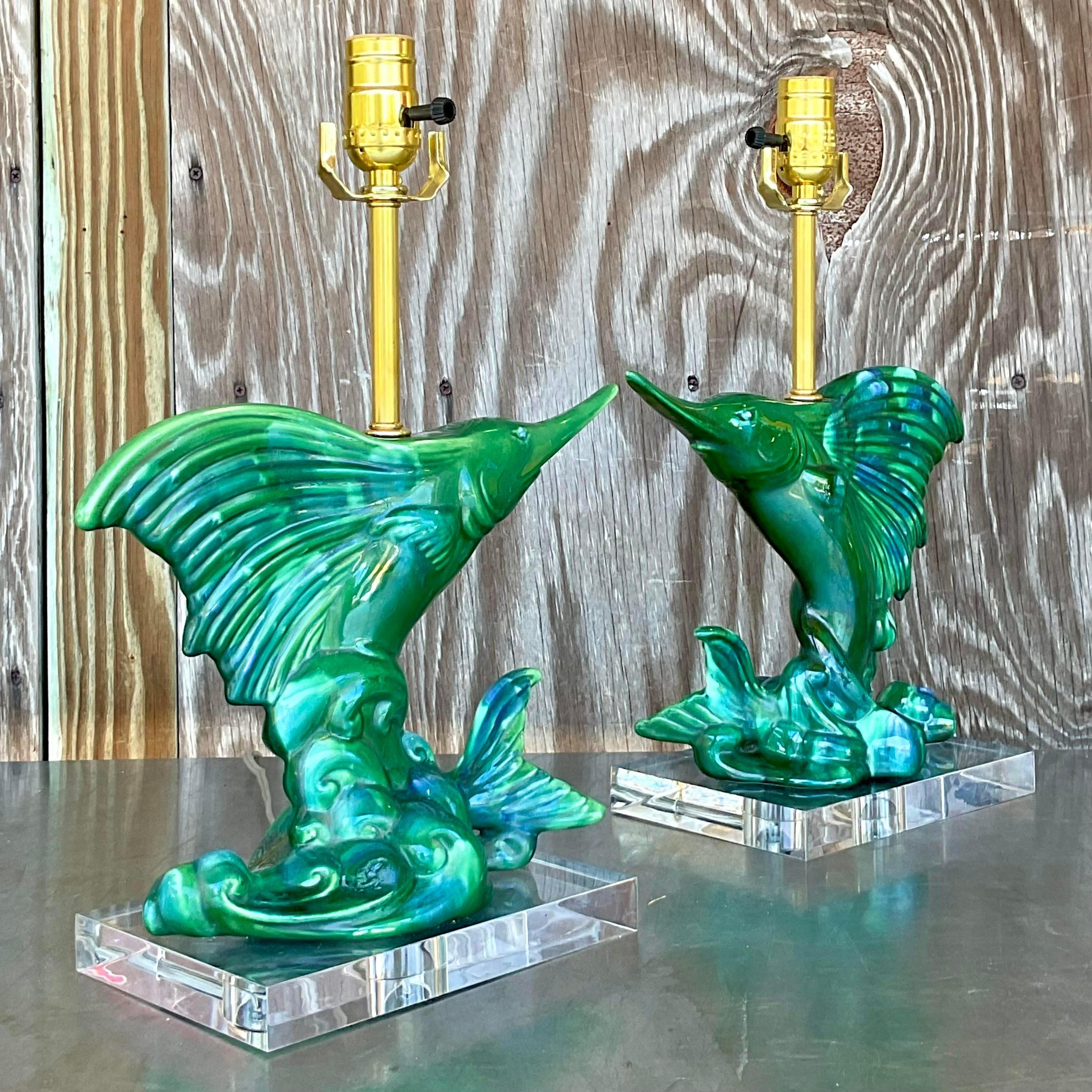 Illuminate your space with these vintage coastal Royal Haeger sailfish lamps. Featuring sleek, sculpted sailfish designs, these ceramic lamps capture the essence of oceanic elegance. Perfect for adding a splash of seaside charm to any room, they're