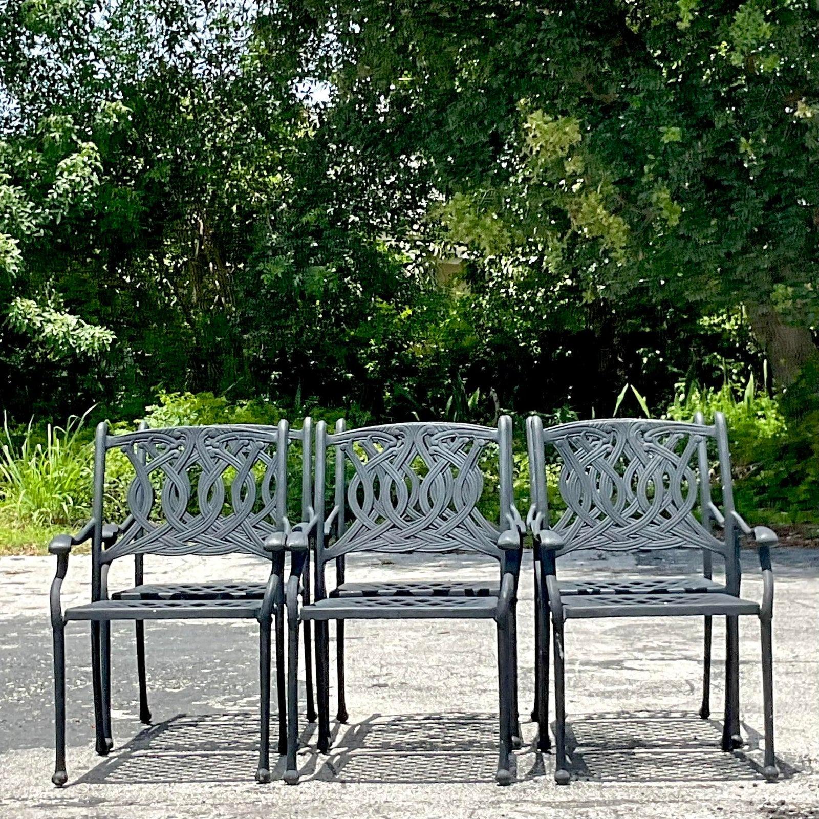 A fabulous set of 6 vintage Coastal Cast Aluminum outdoor dining chairs. A chic scroll design in a matte black finish. Perfect as is or easily painted to suit your project. Additional chairs available. Acquired from a Palm Beach estate.

Seat height