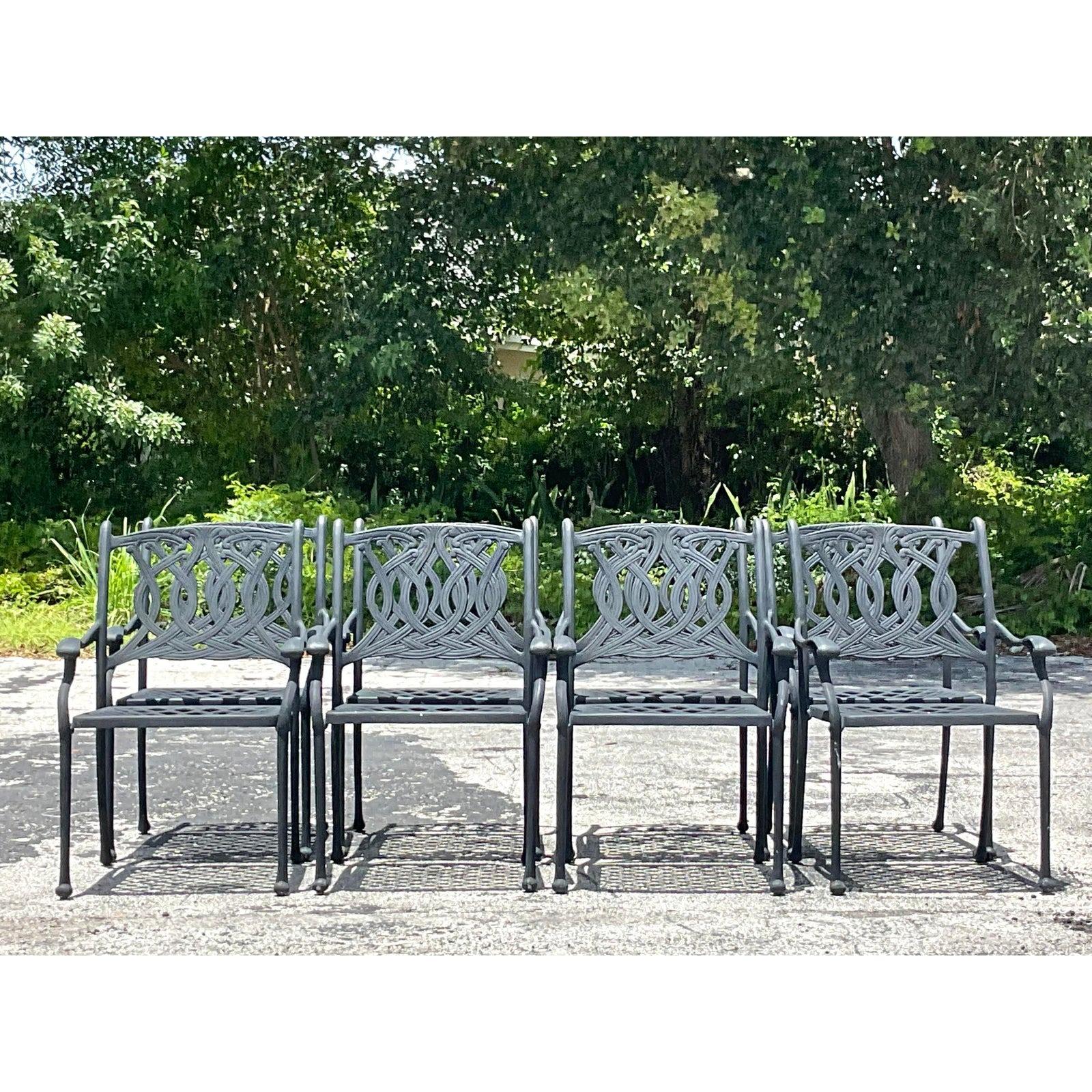 A fabulous set of 8 vintage Coastal outdoor cast aluminum dining chairs. A chic scroll design in a matte black finish. Perfect as is or easily repainted to suit your project. Additional chairs available. Acquired from a Palm Beach estate.

Seat