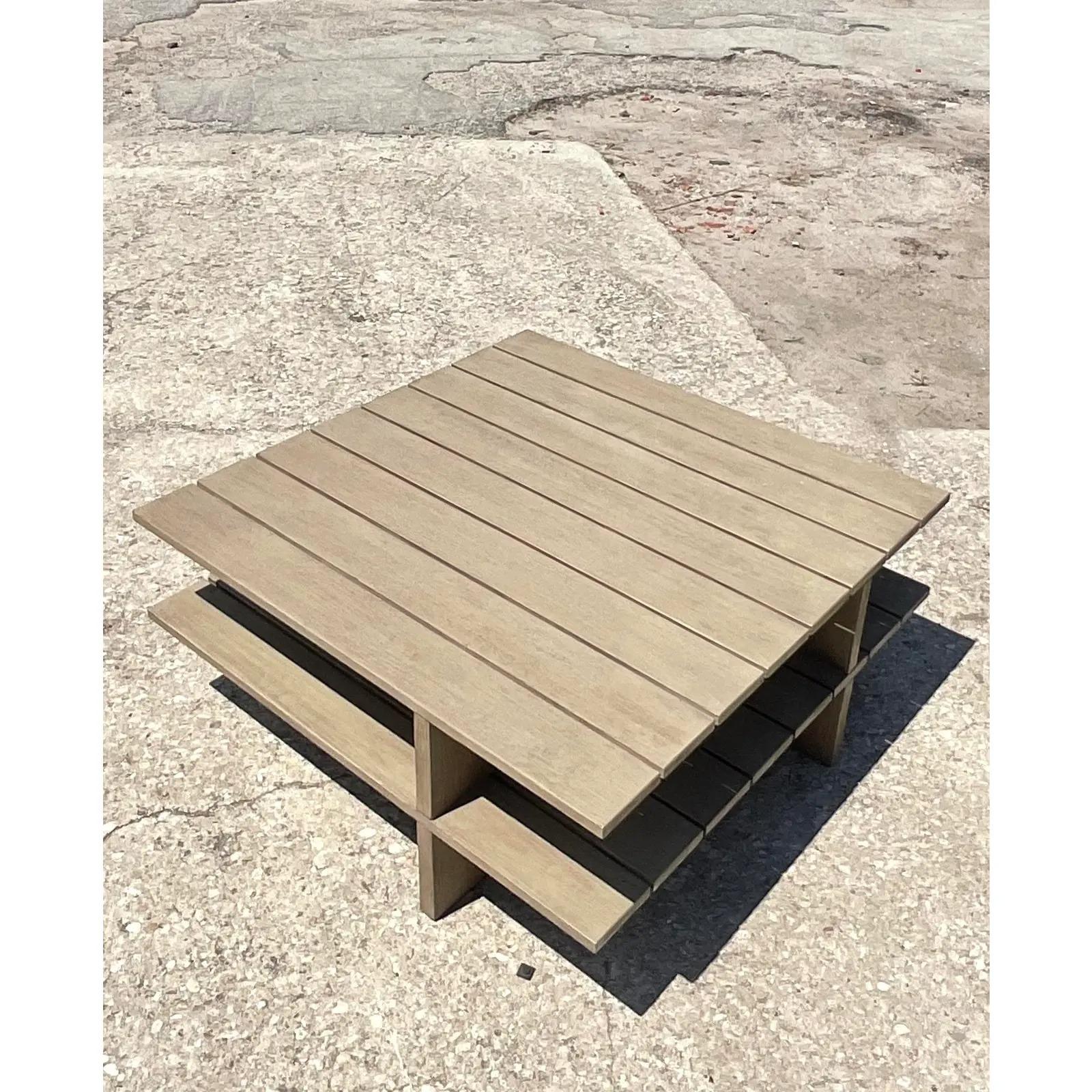 Fantastic vintage outdoor coffee table. Beautiful pale grey wood slat design. Simple two tier design which will easily add into any décor. Acquired from a Palm Beach estate.
