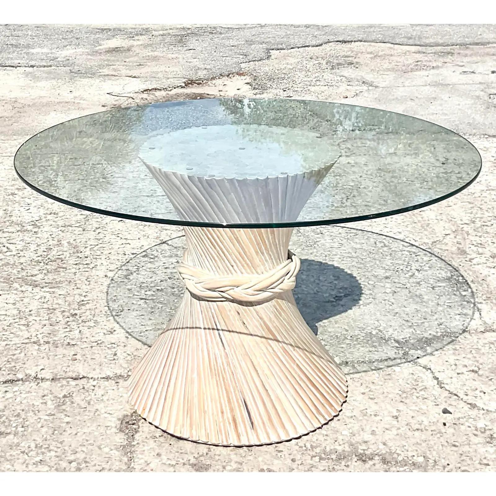 Gorgeous vintage Coastal Pretzel rattan dining table. The iconic sheath of wheat in a chic cerused finish. Done in the manner of McGuire. Acquired from a Palm Beach estate.