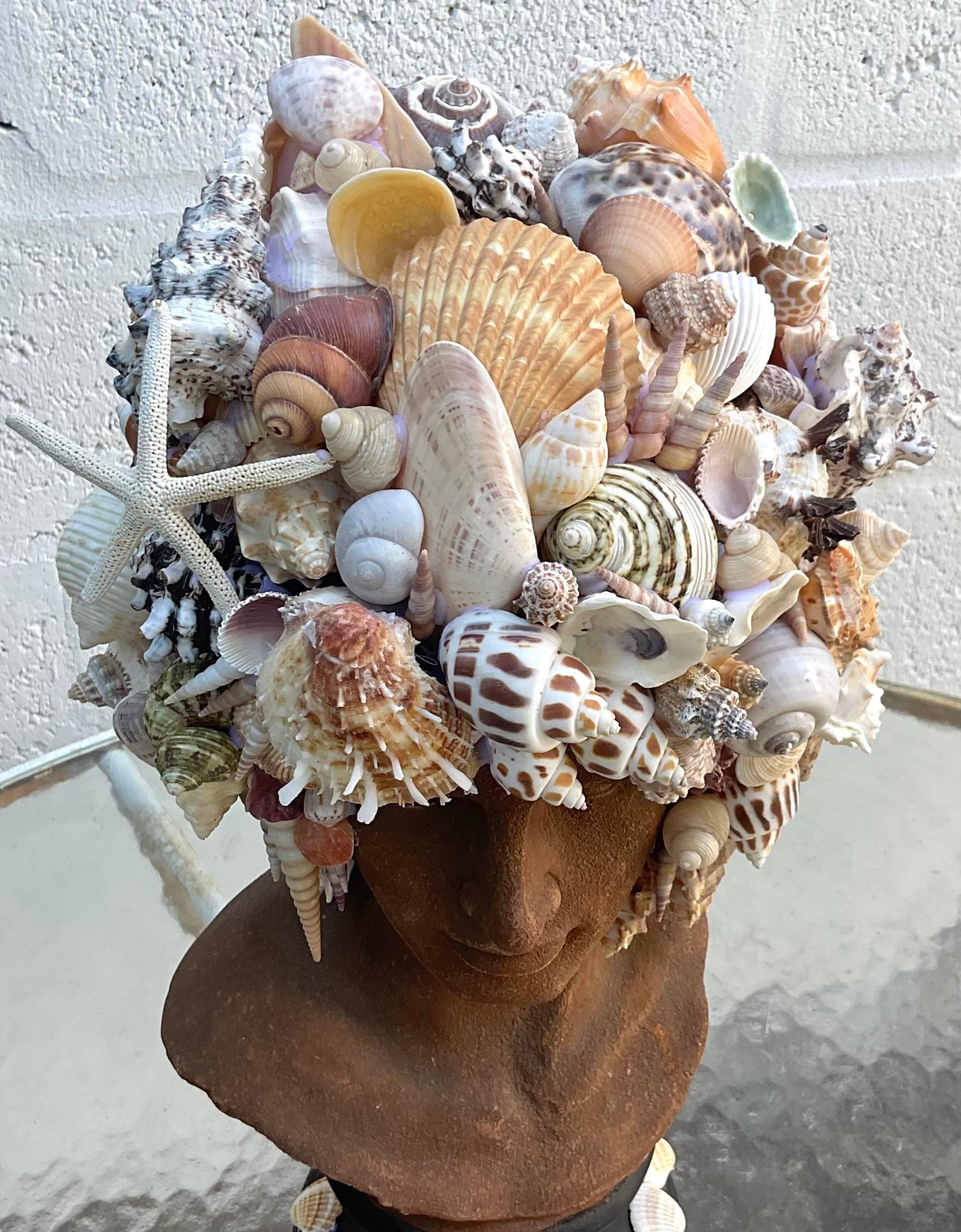 A fabulous vintage Coastal bust of man. A chic resin figure encrusted with a beautiful selection of curated shells. Hand made by a local Palm Beach artisan. Acquired from a Palm Beach estate.