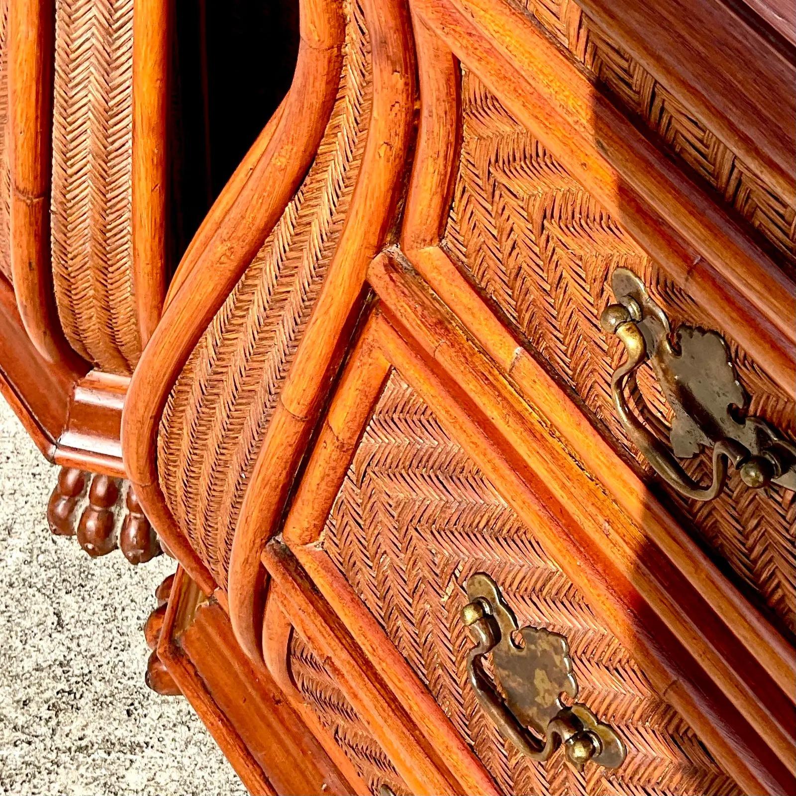 A fantastic pair of vintage Coastal nightstands. Made by the iconic Ficks Reed group. Beautiful wood frame with inset woven rattan panels. Signed inside the drawer. Acquired from a Palm Beach estate.