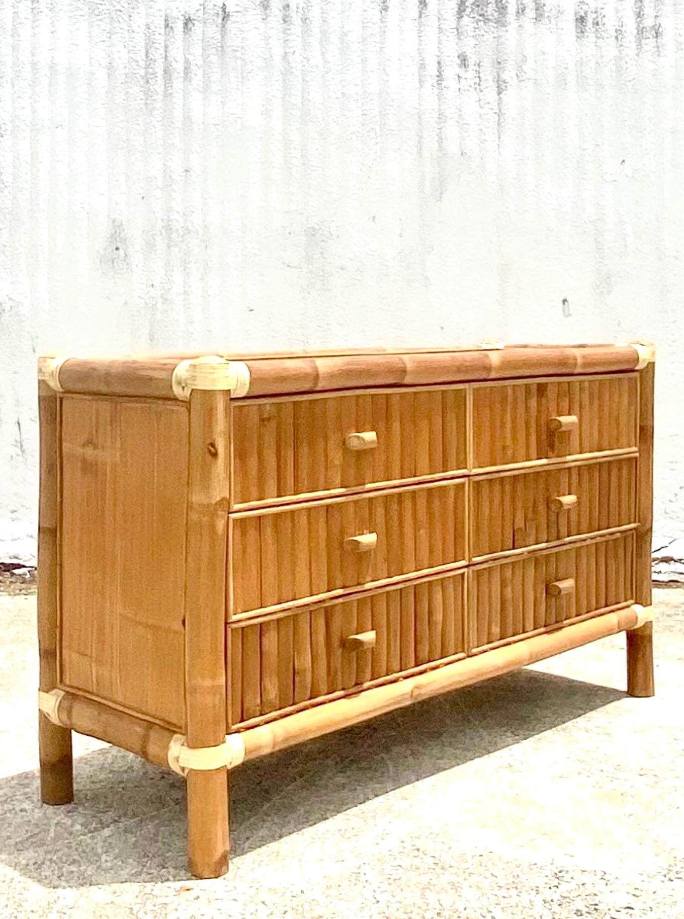 Fantastic vintage split bamboo dresser. Chic elephant bamboo frame with split bamboo inset panels. Leather wraps on the joints. Acquired from a Palm Beach estate.