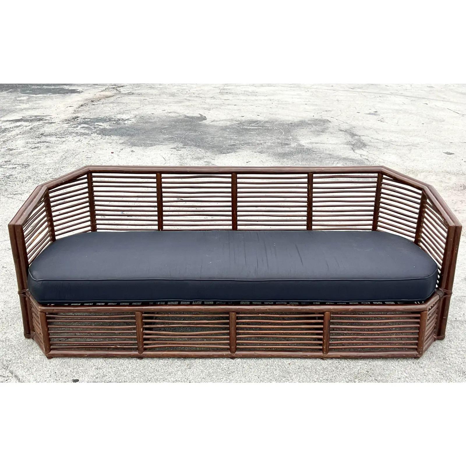 Fantastic vintage Coastal sofa. Beautiful stacked rattan in a chic angular design. A stunning profile. Acquired from a Palm Beach estate.