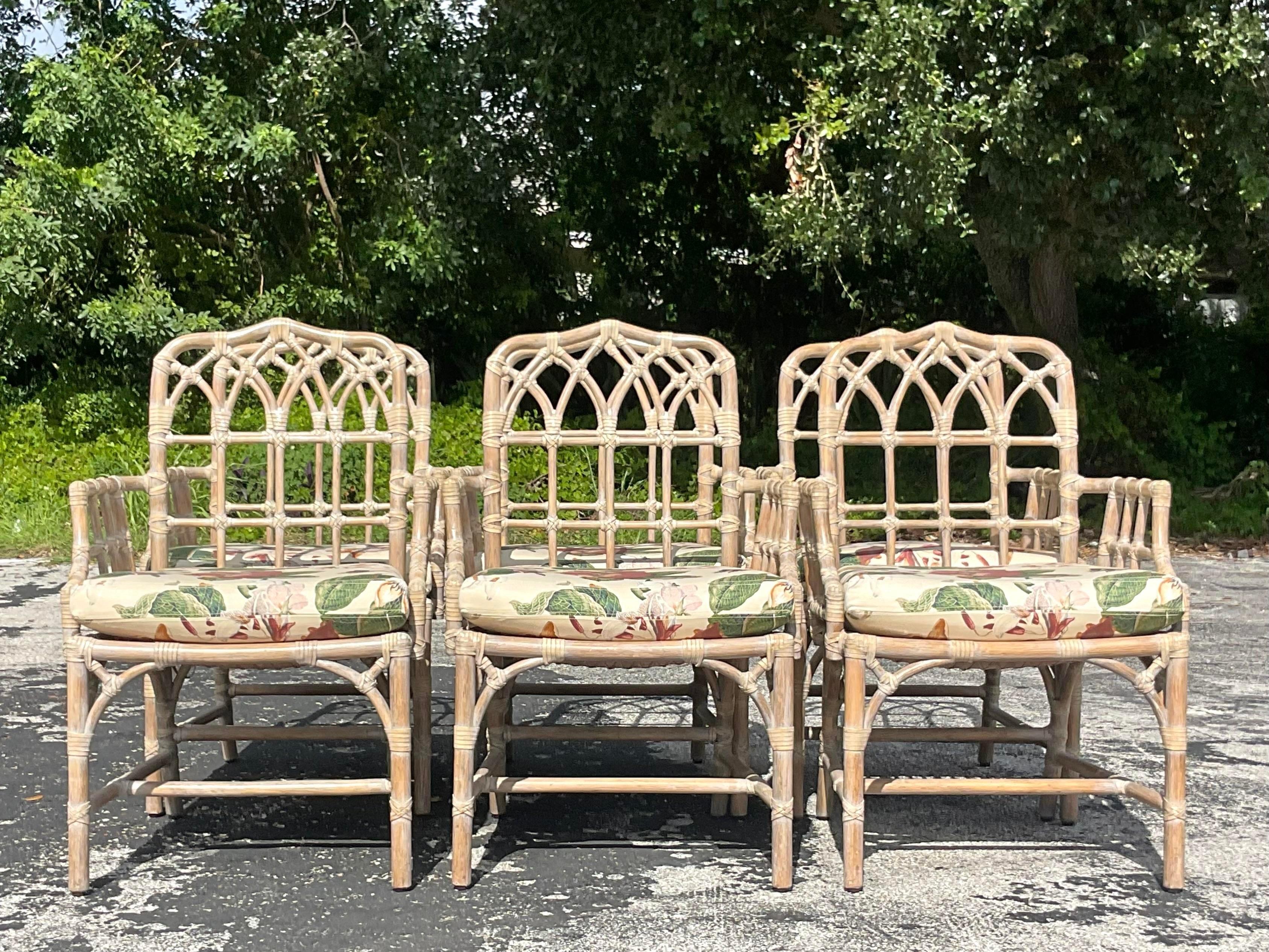 A fantastic set of 6 vintage Coastal dining chairs. Made by the iconic McGuire group and tagged on the bottom. Beautiful Cathedral design with a cerused finish. Acquired from a Palm Beach estate.