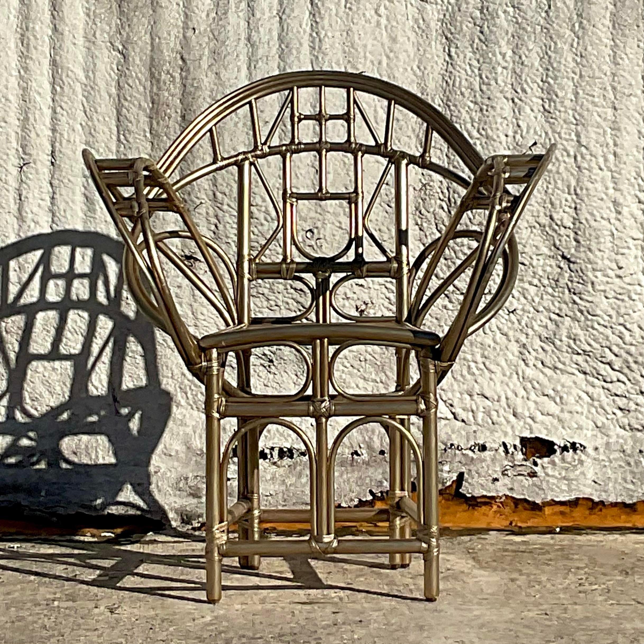 A fabulous vintage Coastal Peacock chair. Made by the iconic McGuire group and tagged below. In the original gold finish. Acquired from a Palm Beach estate