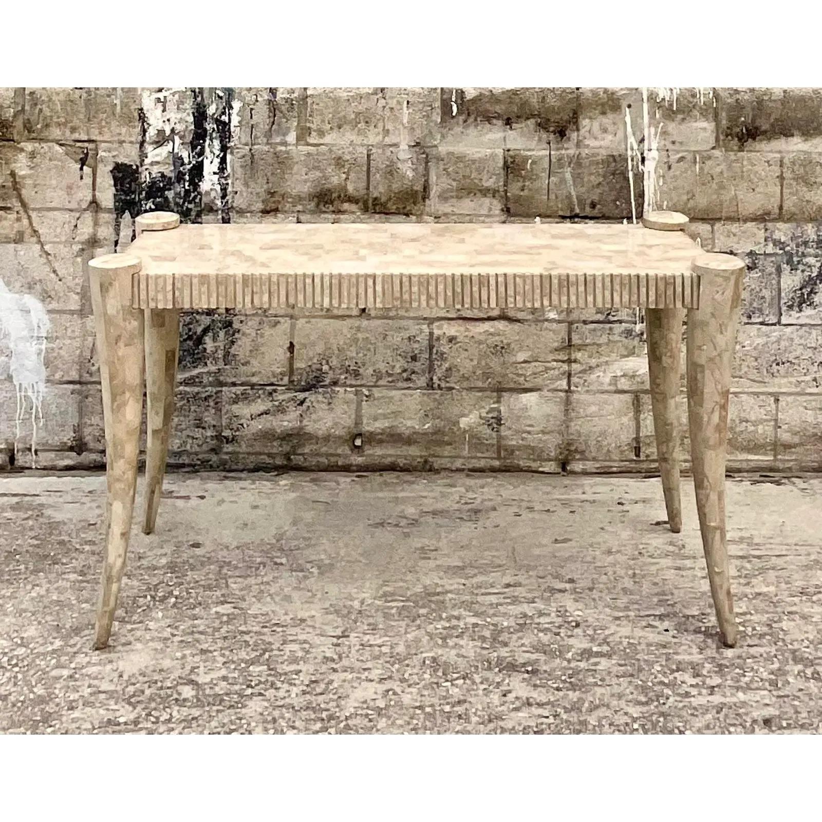 Fantastic vintage Coastal console table. Beautiful tessellated stone with carved detail along the edge. A really striking look. Acquired from a Palm Beach estate.