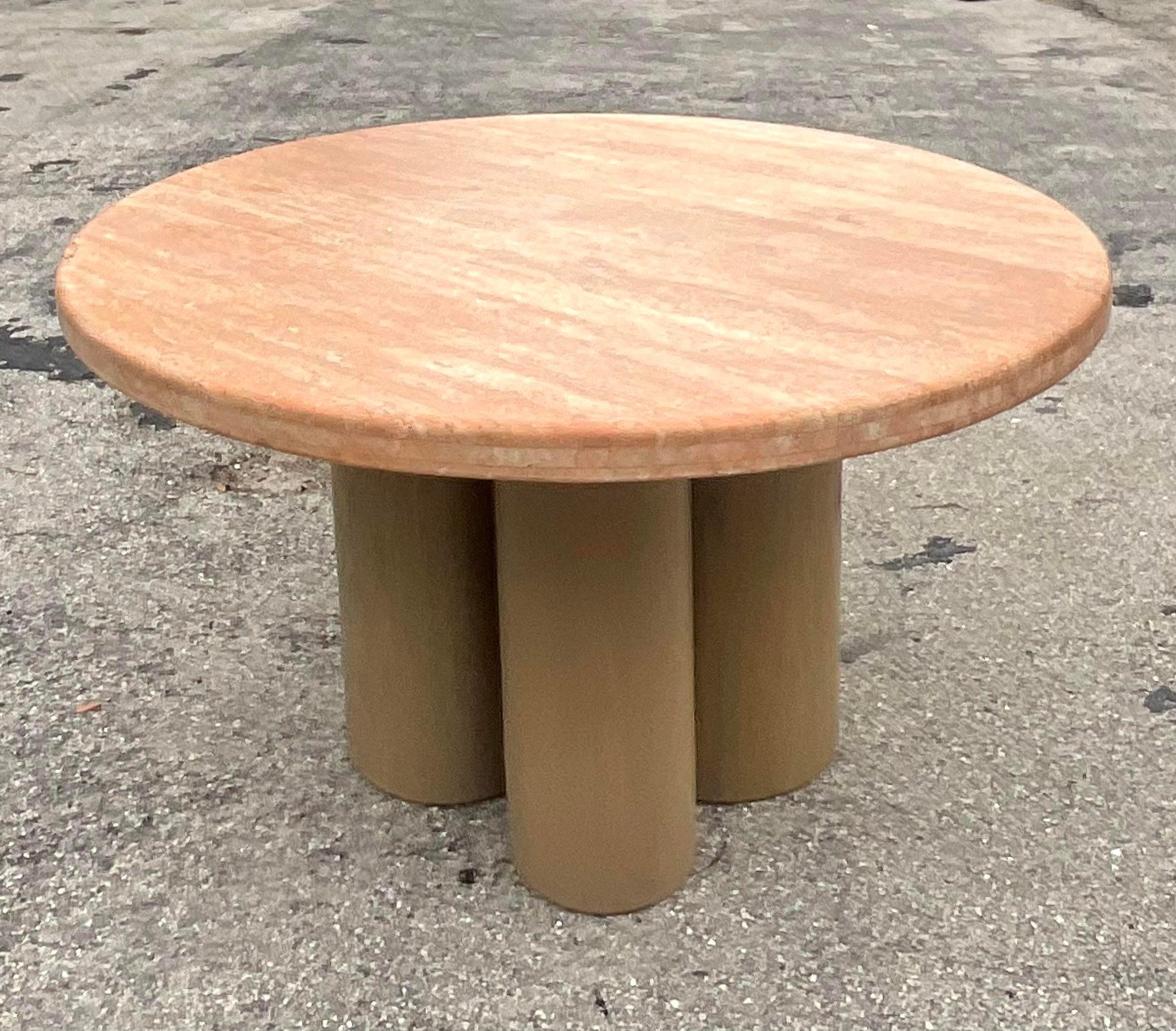 A fabulous vintage contemporary dining table. A chic custom built round table with a tessellated stone top. A bundled cylinder base in a cerused oak. Acquired from a Palm Beach estate. 