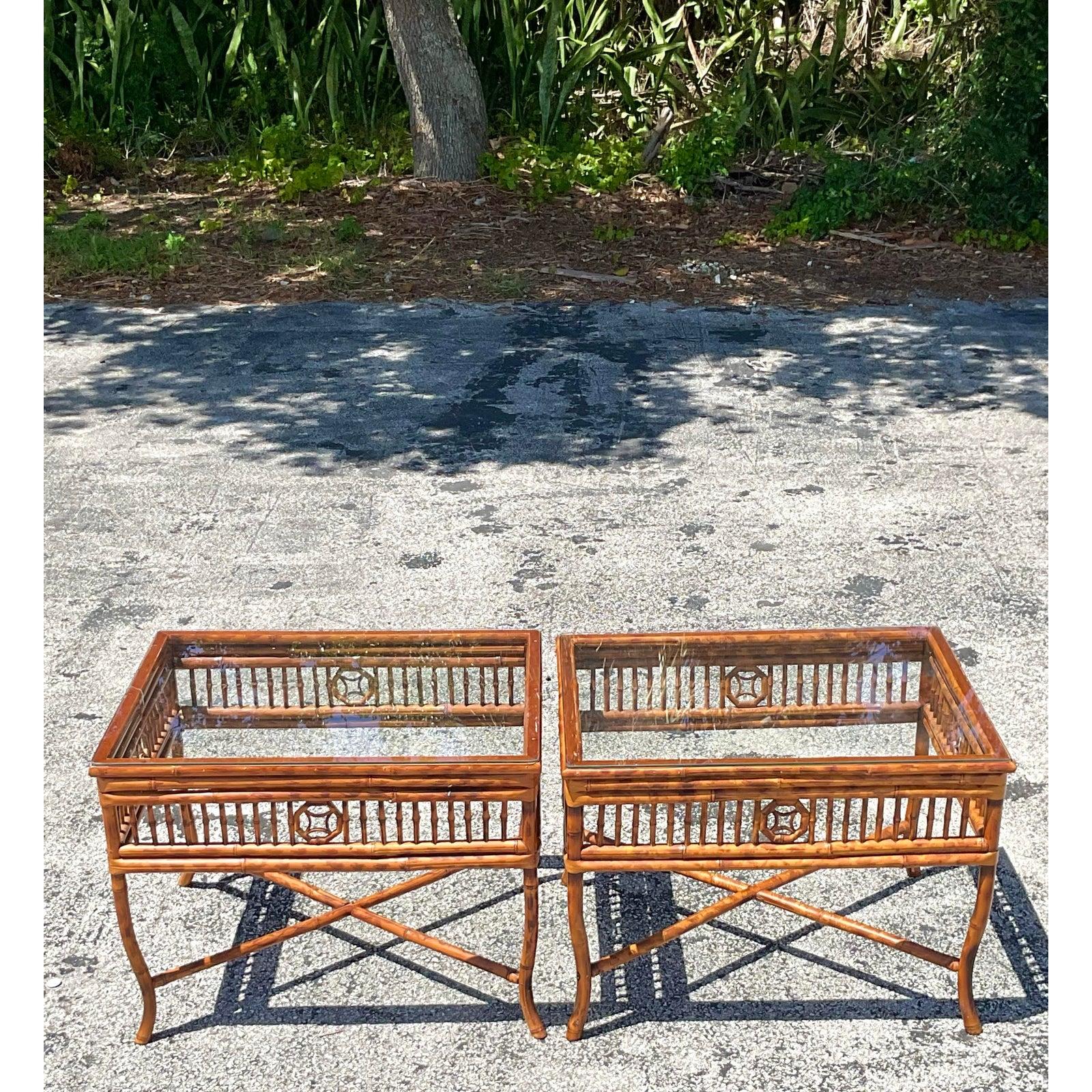 Bring breezy coastal charm and organic sophistication to your space with this striking pair of Vintage Tortoise Bamboo Side Tables. Expertly handcrafted, these tropical-inspired accent tables feature rich bamboo frames with eye-catching spindle side