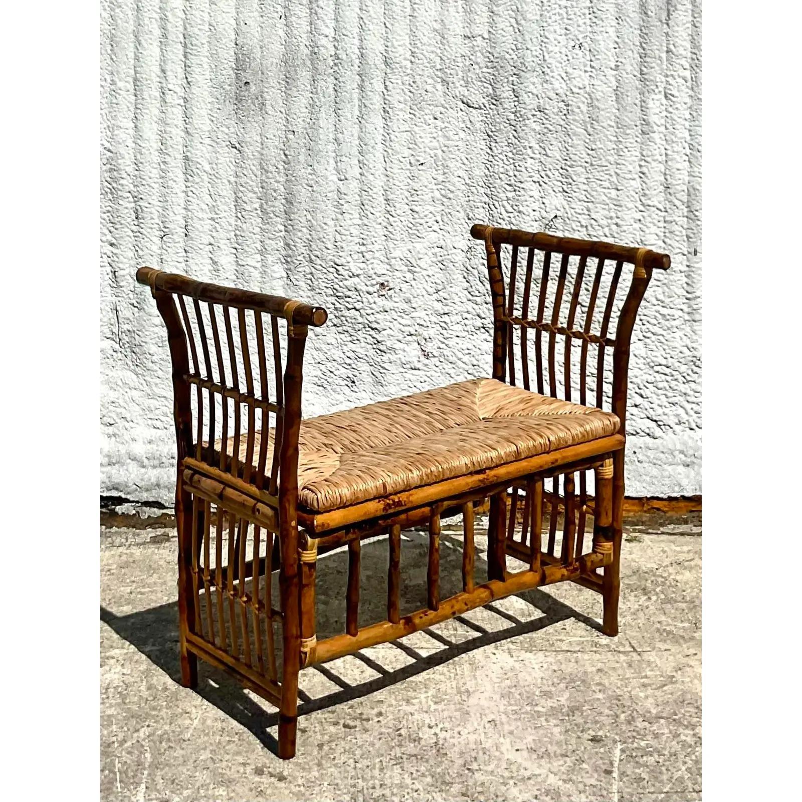 Incredible vintage Coastal bench. Beautiful heavy bamboo in a tortoise shell finish. Upholstered. Acquired from a Palm Beach estate.