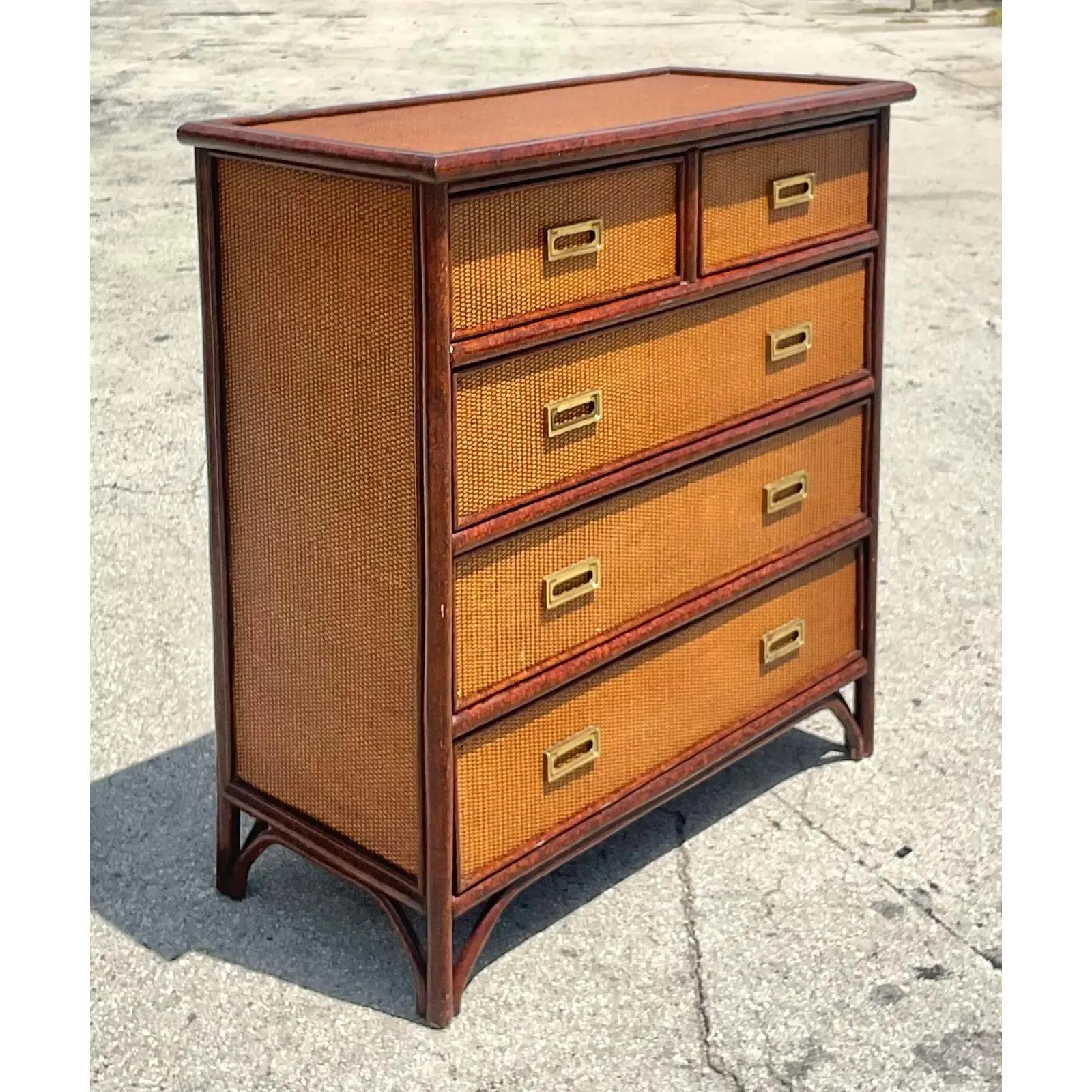 Fabulous vintage Coastal chest of drawers. A gorgeous tortoise shell finish on the frame with inset woven rattan panels. Acquired from a Palm Beach estate.