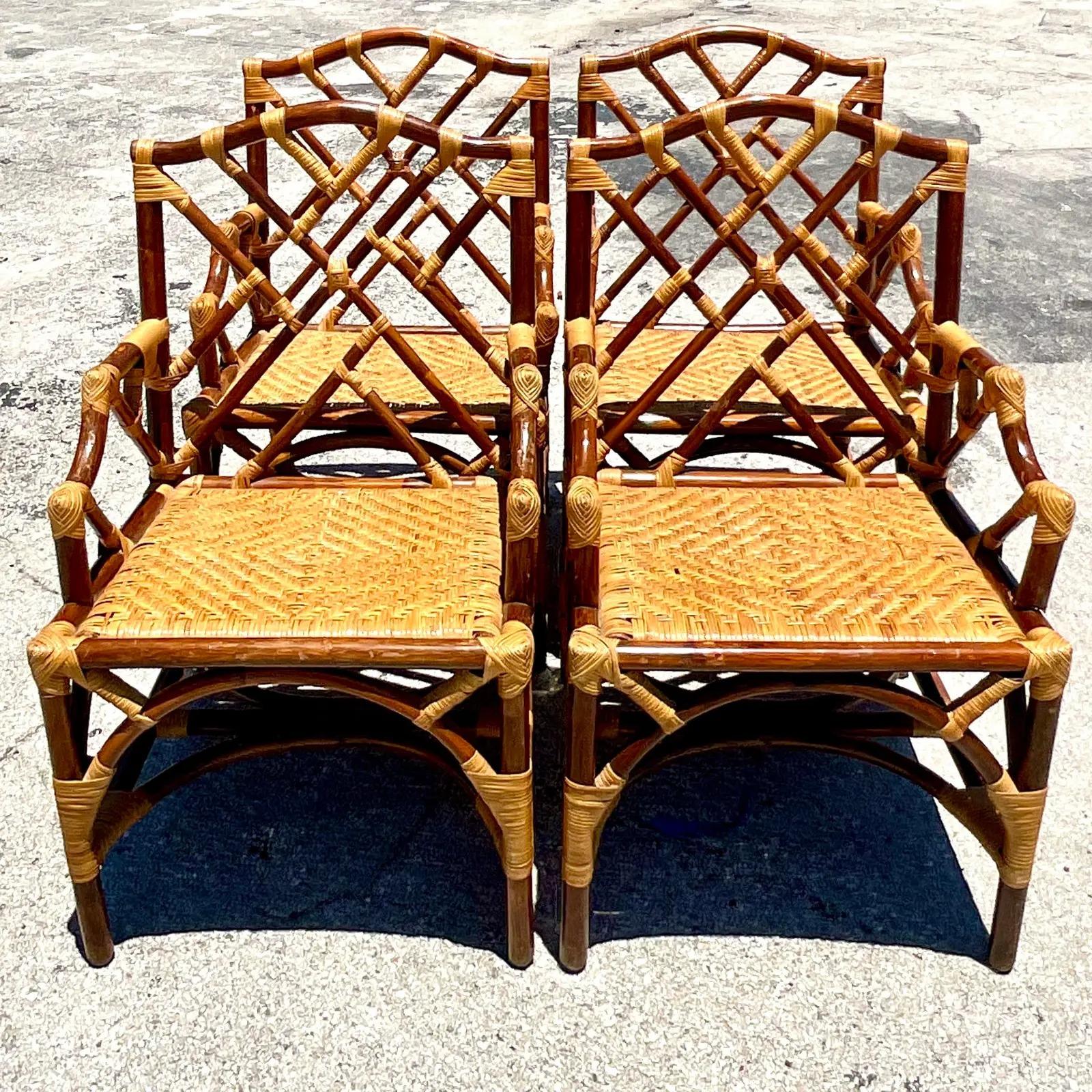 Fantastic set of four vintage Coastal dining chairs. Beautiful tortoise shell finish on an iconic Chinese Chippendale design. Beautiful woven rattan seats. Acquired from a Palm Beach estate.