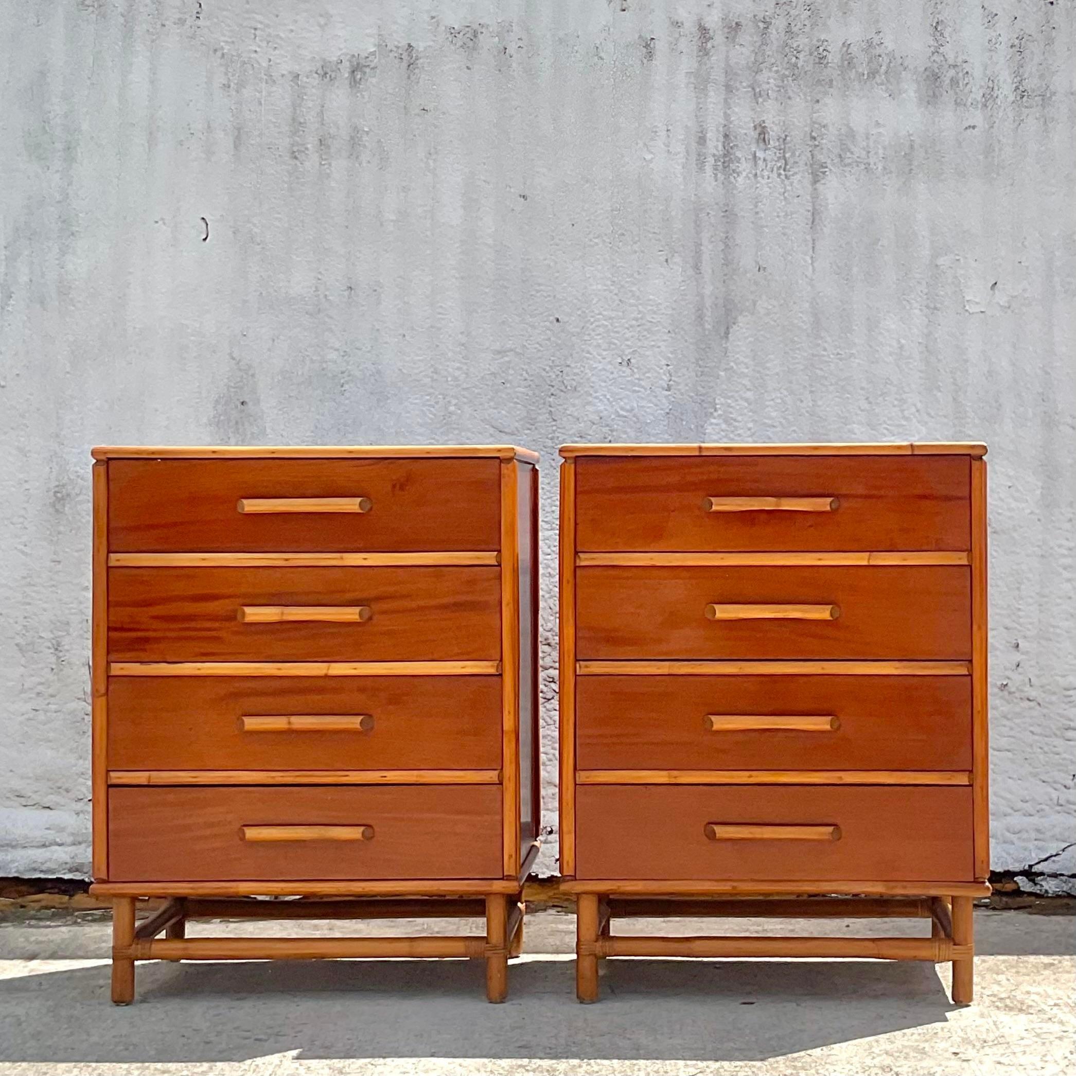 An exceptional pair of vintage 1950s Coastal chest of drawers. Beautiful and tall Mahogany cabinets with rattan trim. Chis brass caps on the ends. Matching dresser also available on my Chairish page. Acquired from a Palm Beach estate.