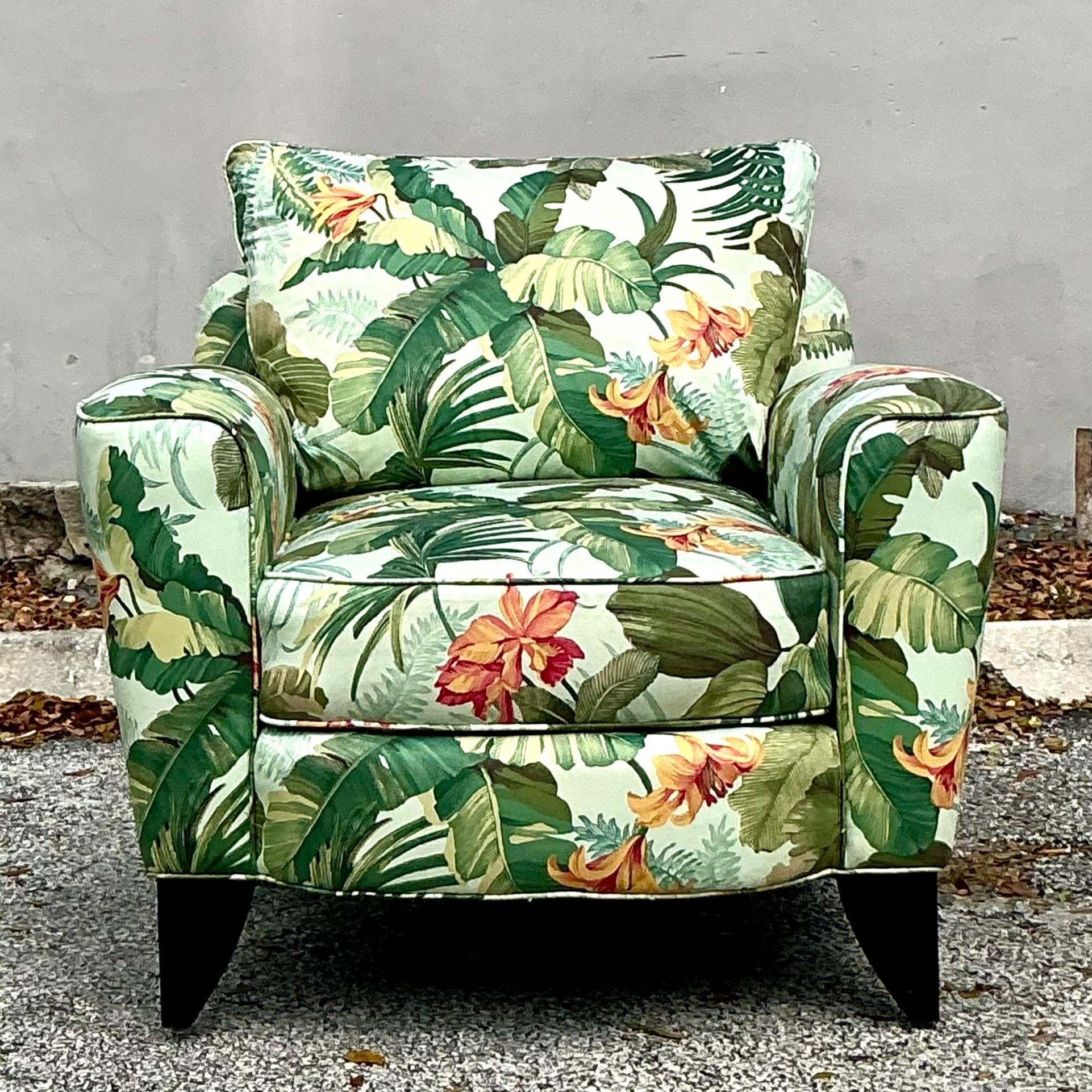Embrace island vibes with this Vintage Coastal Tropical Print Lounge Chair, a perfect blend of comfort and style. Upholstered in a lush, tropical print fabric featuring vibrant foliage and exotic flora, this chair brings a splash of color and warmth