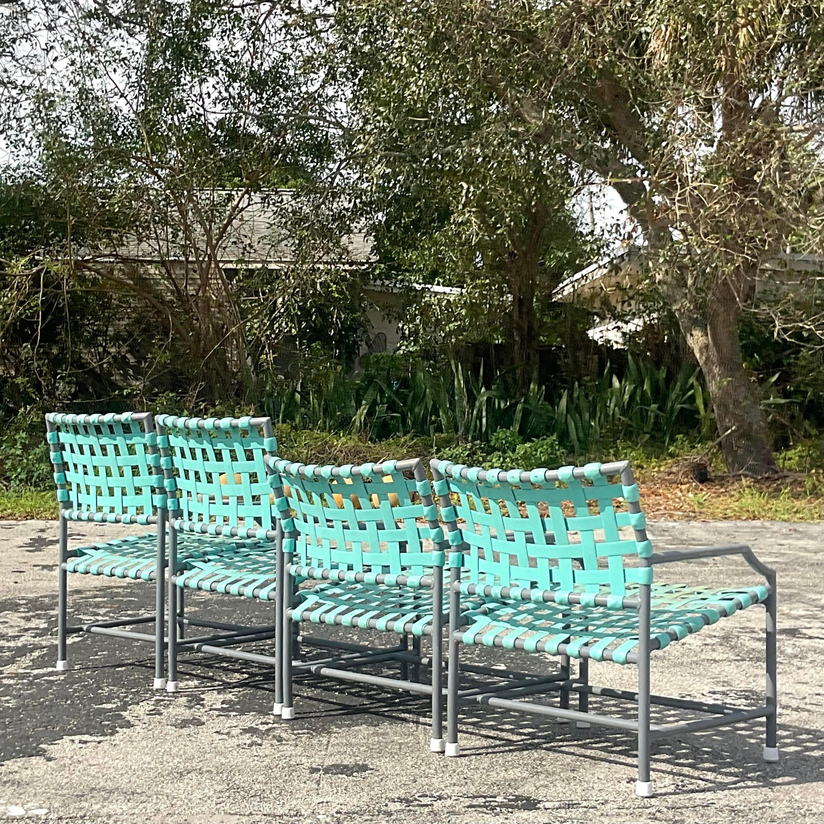 A fabulous set of vintage Coastal outdoor chairs. Made by the iconic Tropitone group and tagged below. Two dining chairs and two low lounge chairs. Brilliant jade green with smoke grey aluminum frame. Acquired from a Palm Beach estate.

Lounge