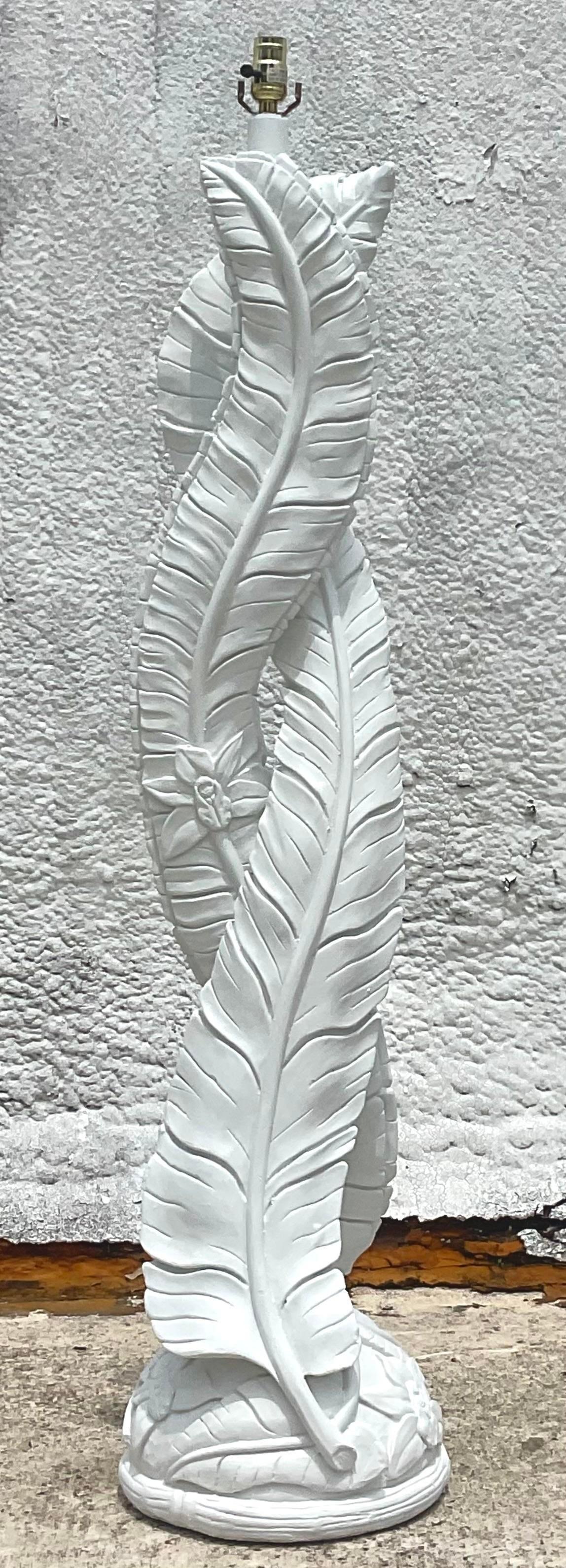 A fabulous vintage Coastal floor lamp. Beautiful twisted banana leaf design in a white plaster finish. Acquired from a Palm Beach estate.