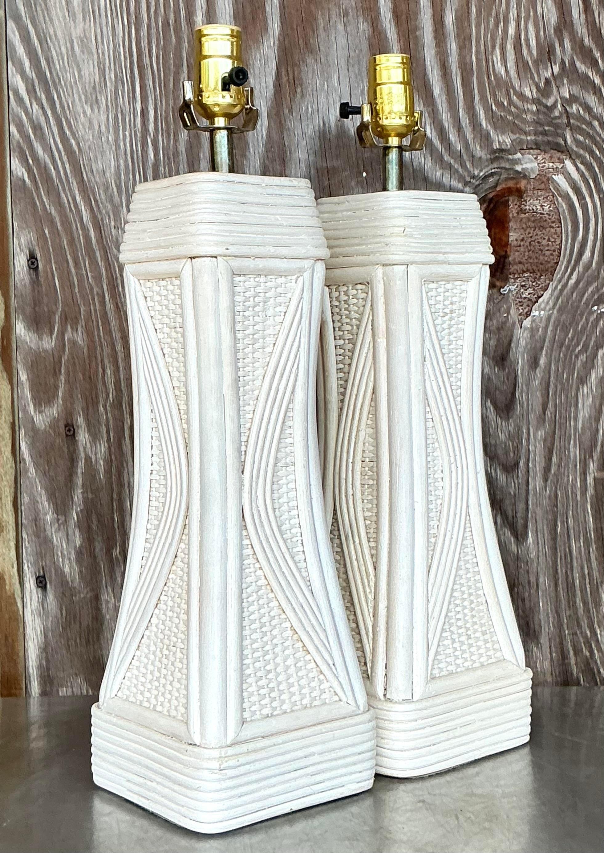 Brighten your space with this charming pair of Vintage Coastal Washed Pencil Reed Lamps. Featuring handwoven pencil reed bases with a soft, sun-kissed wash, these lamps evoke a relaxed coastal vibe while adding a touch of natural texture. Their