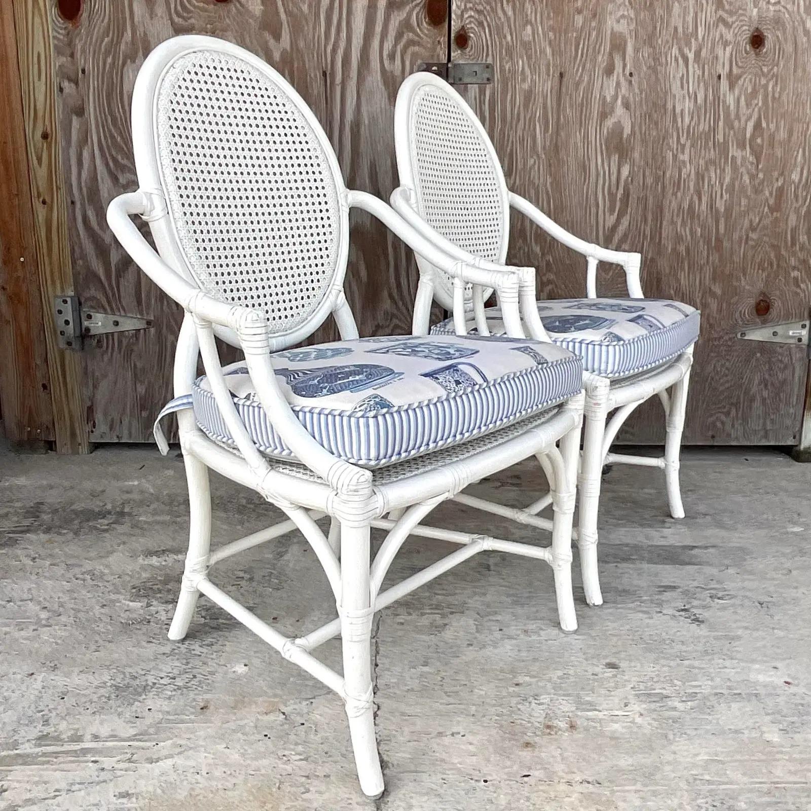 20th Century Vintage Coastal White Lacquered Rattan McGuire Cane Arm Chairs - a Pair