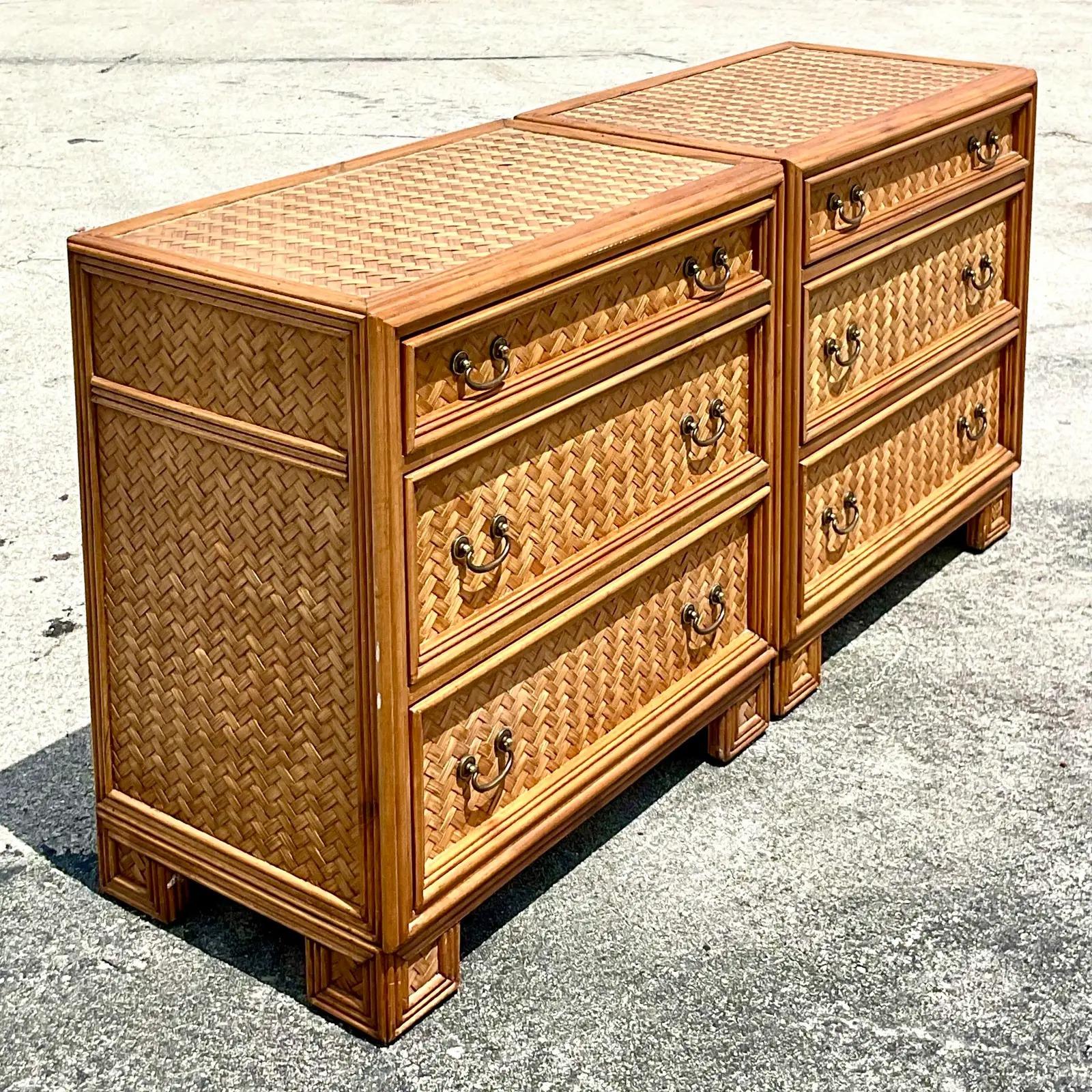 Fantastic pair of vintage Coastal chest of drawers. Made by the Whitecraft group. Beautiful woven rattan with solid rattan trim. Acquired from a Palm Beach estate.