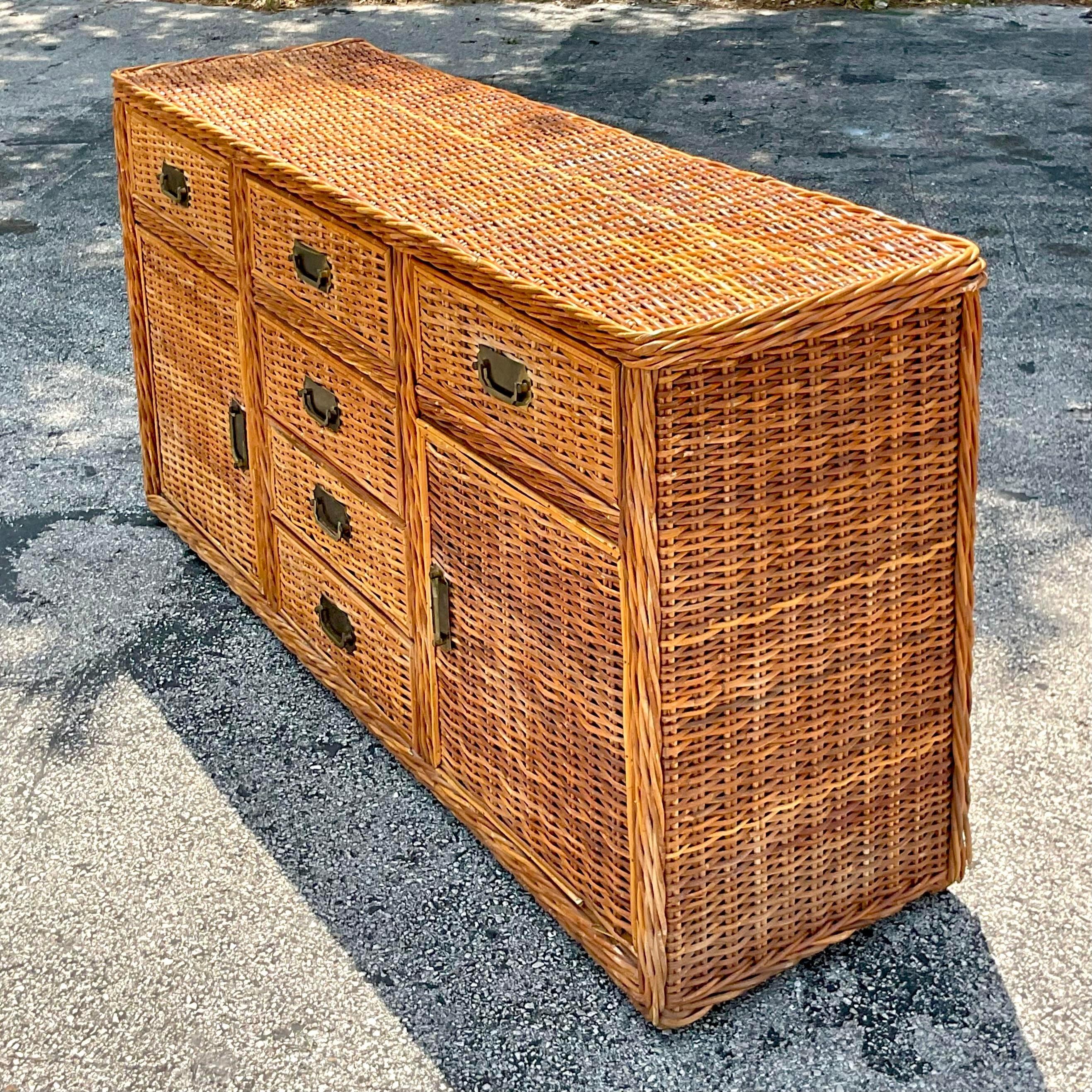 Enhance your home with the Vintage Coastal Woven Rattan Credenza. This American-style piece combines natural rattan craftsmanship with functional elegance, offering ample storage and a touch of relaxed coastal sophistication to any room.