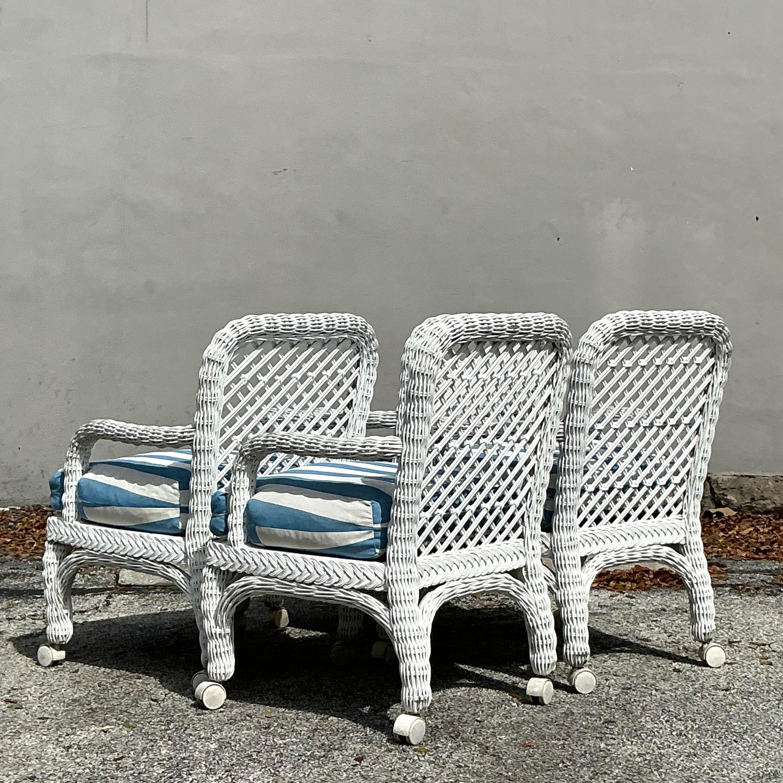 Americano Sedie da pranzo in rattan intrecciato vintage con rotelle - Set di 4 sedie in vendita