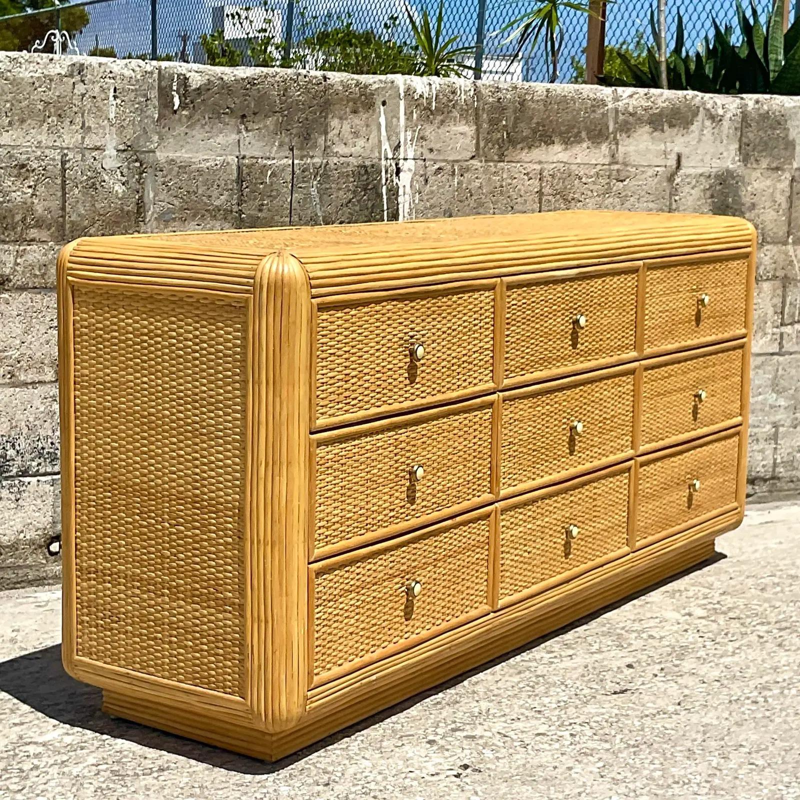 Fantastic vintage Coastal standard dresser. Beautiful pencil reed frame with inset woven rattan panels. A striking overall look. Acquired from a Palm Beach estate.