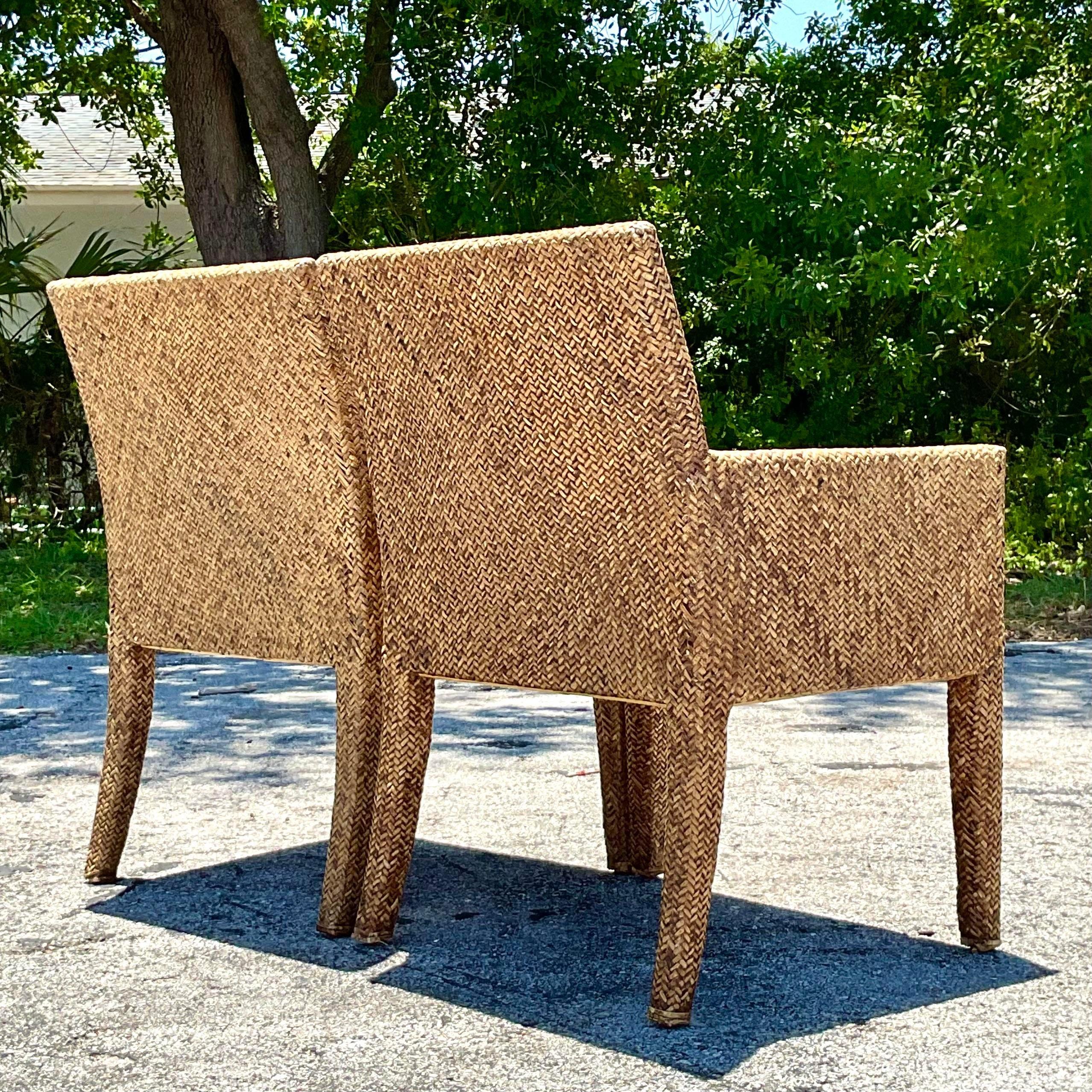 The Vintage Coastal Woven Rattan Lounge Chairs - A Pair capture the essence of American coastal style with their classic rattan weaving and relaxed, inviting design. These charming lounge chairs evoke a sense of seaside living, offering both comfort