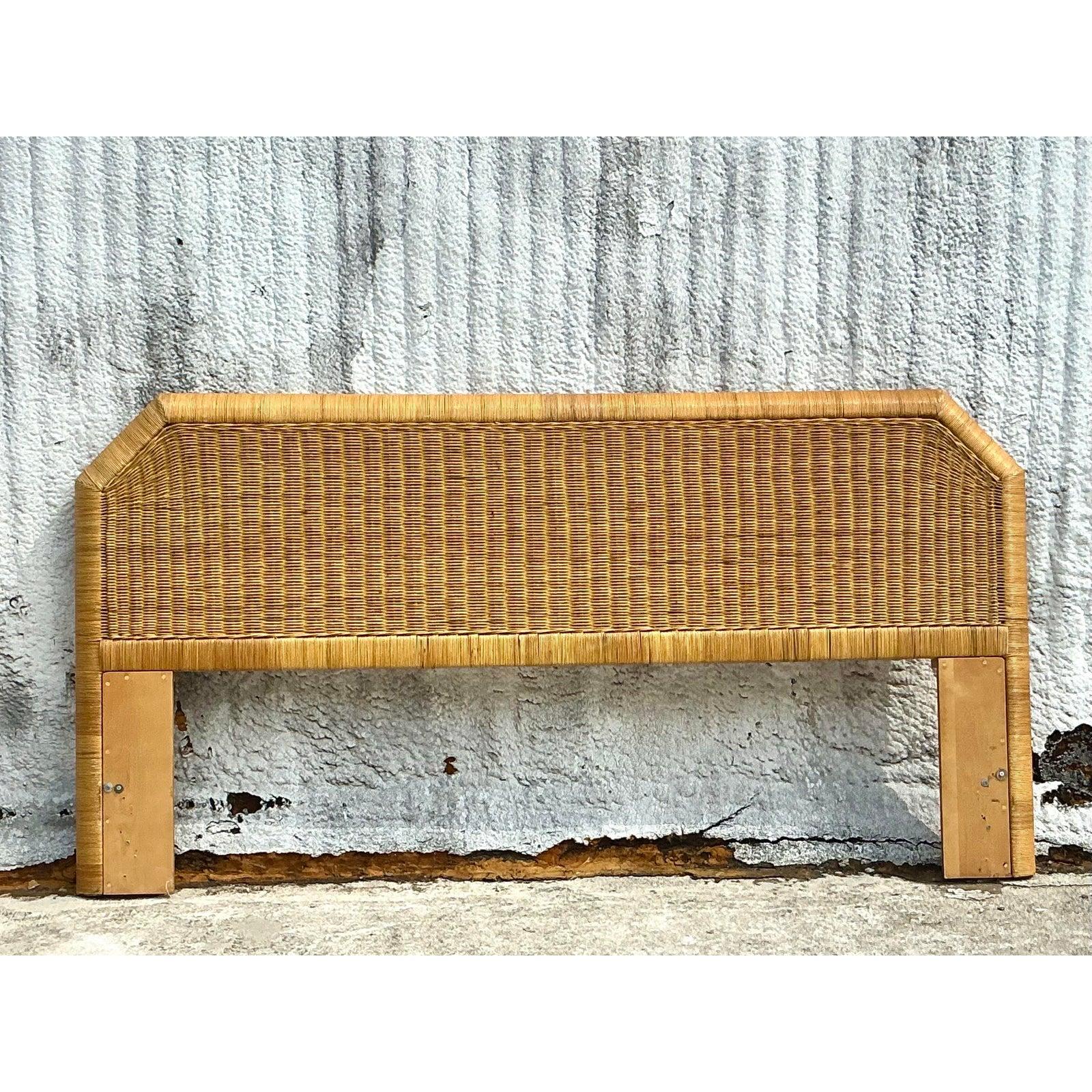 Embrace the relaxed elegance of coastal living with this vintage woven rattan king headboard. Crafted with natural rattan in a warm honey finish, this piece exudes organic charm while maintaining a sturdy and timeless design. The notched edges add a